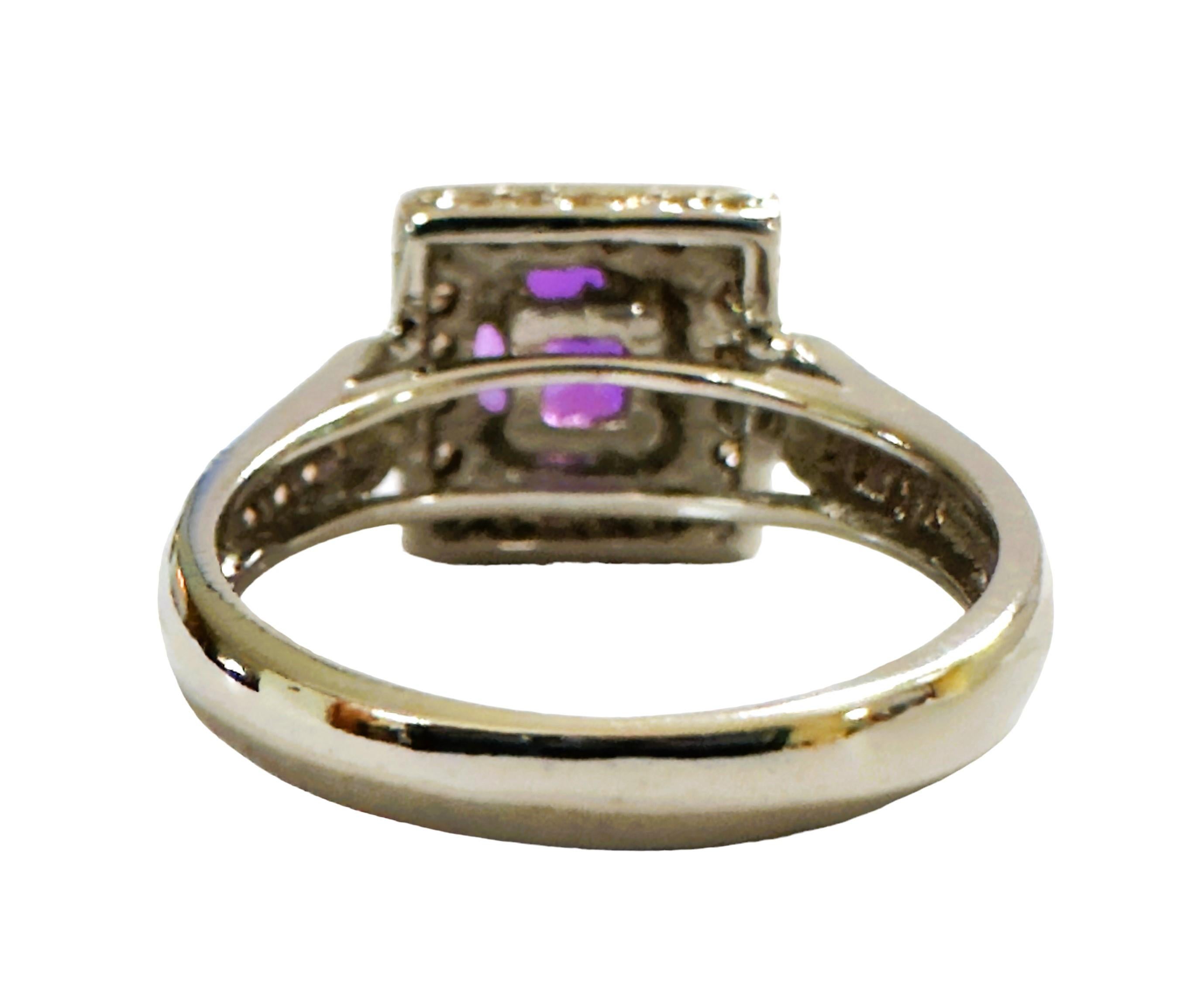 This is just a beautiful gemstone. This beautiful stone has pinks, blues and purples in it.  It's just spectacular.  The ring is a size 6.  It was mined in Africa and is just exquisite.   A very high quality stone. It is a cushion cut stone and is