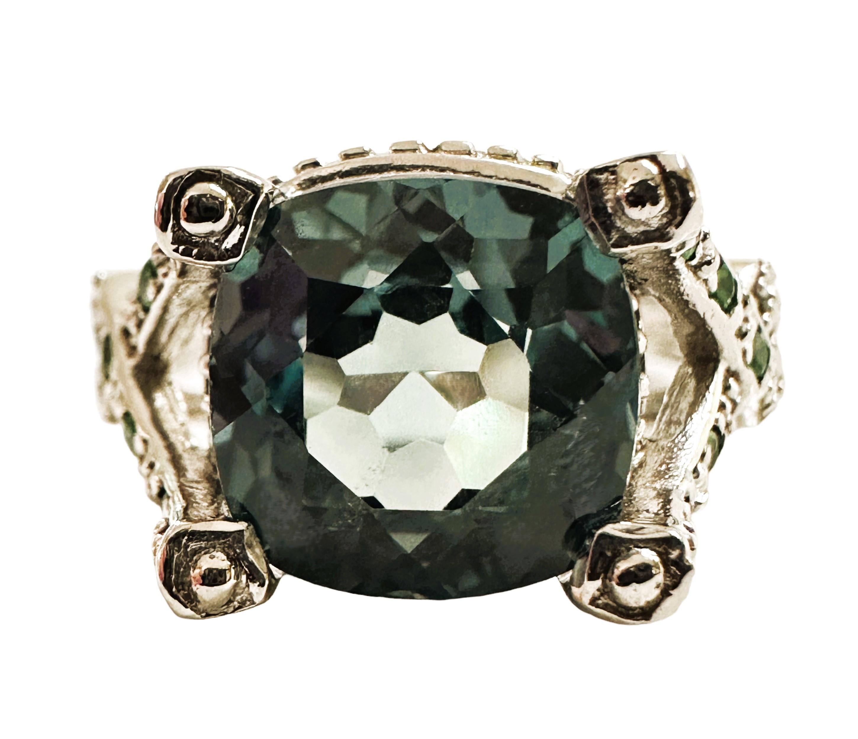 The ring is a size 6.25 and has just a beautiful setting..  It is from Africa.  It is a very high quality stone.  The stone is as cushion cut stone and is 4 cts.   It is a beautiful design   The main stone measures 9.2 mm and has diamond cut white