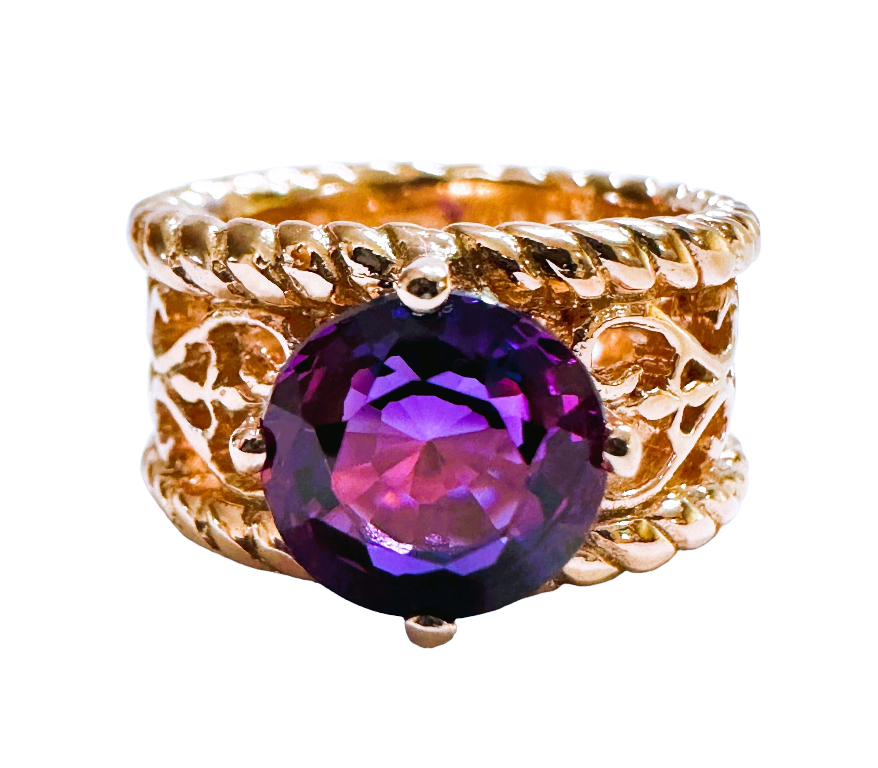 This is just a beautiful gemstone. This beautiful stone has pinks, blues and purples in it.  It's just spectacular.  The ring is a size 5.75.  It was mined in Africa and is just exquisite.   A very high quality stone. It is a round cut stone and is
