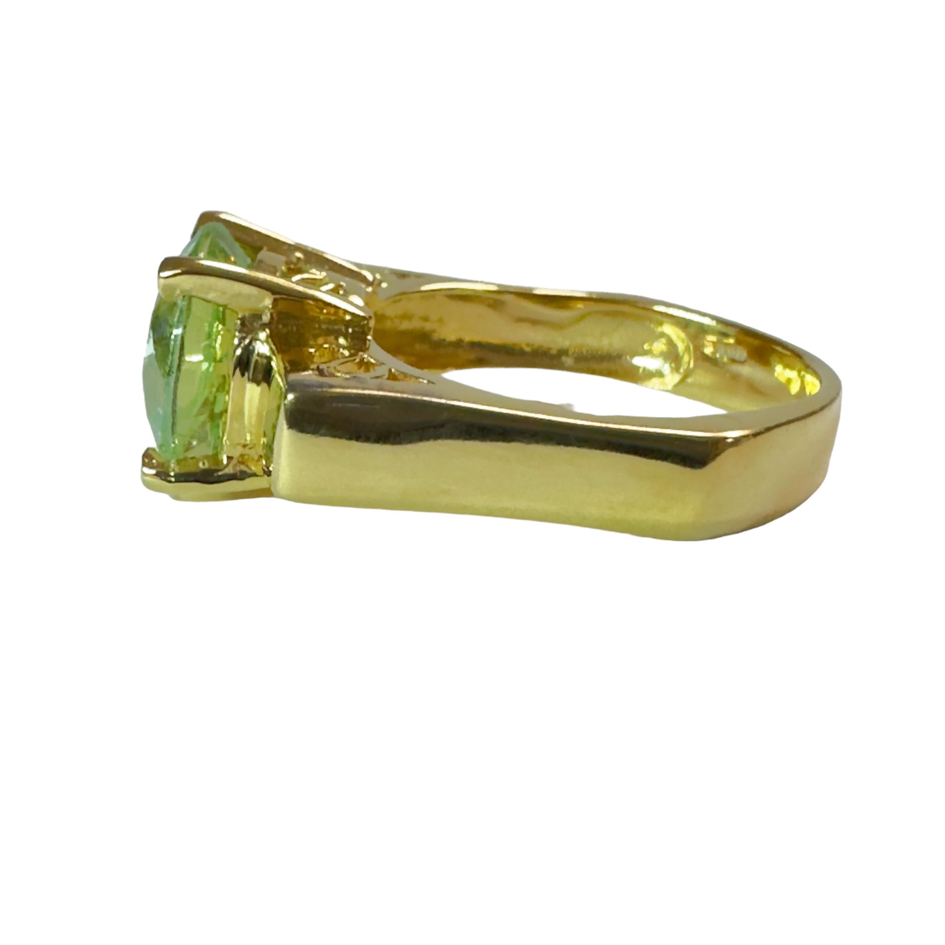 This is a very cool looking ring.  I love the squared setting it has.  This stone is from Africa and just a beautiful color of green. The setting is beautiful yellow gold plating which really compliments the stone.  The ring is a size 6.5.   It is a