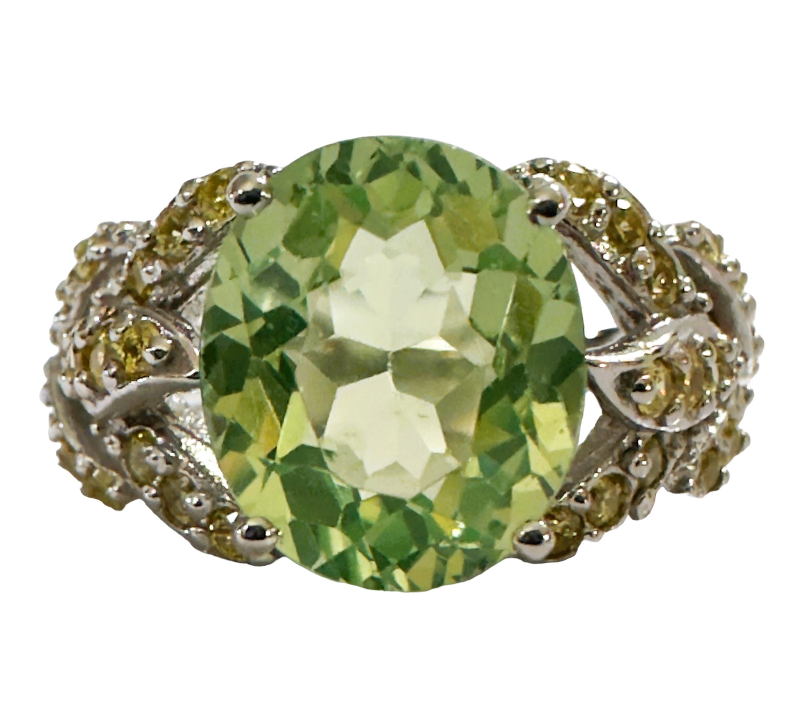 I just love this ring!  The color combination of these stones are just gorgeous.  The ring is a size 6.   The stone is from Africa and is just exquisite.  It is a highly rated stone.  It is an oval cut stone and is 4.70 Cts   The main stone is 11 x