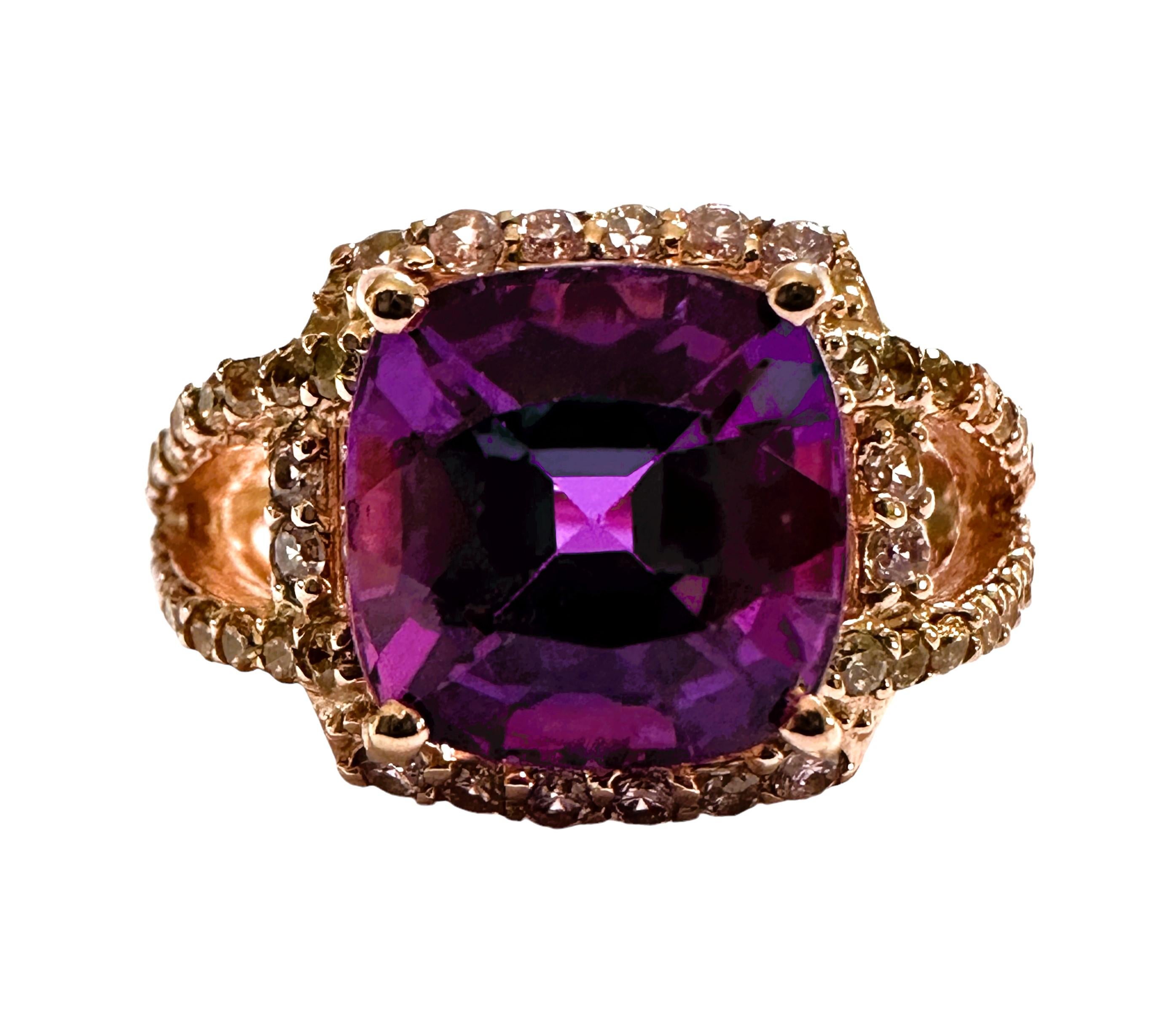 This is just a beautiful gemstone. This beautiful stone has pinks, blues and purples in it.  It's just spectacular.  The ring is a size 6.5.  It was mined in Africa and is just exquisite.   A very high quality stone. It is a cushion cut stone and is