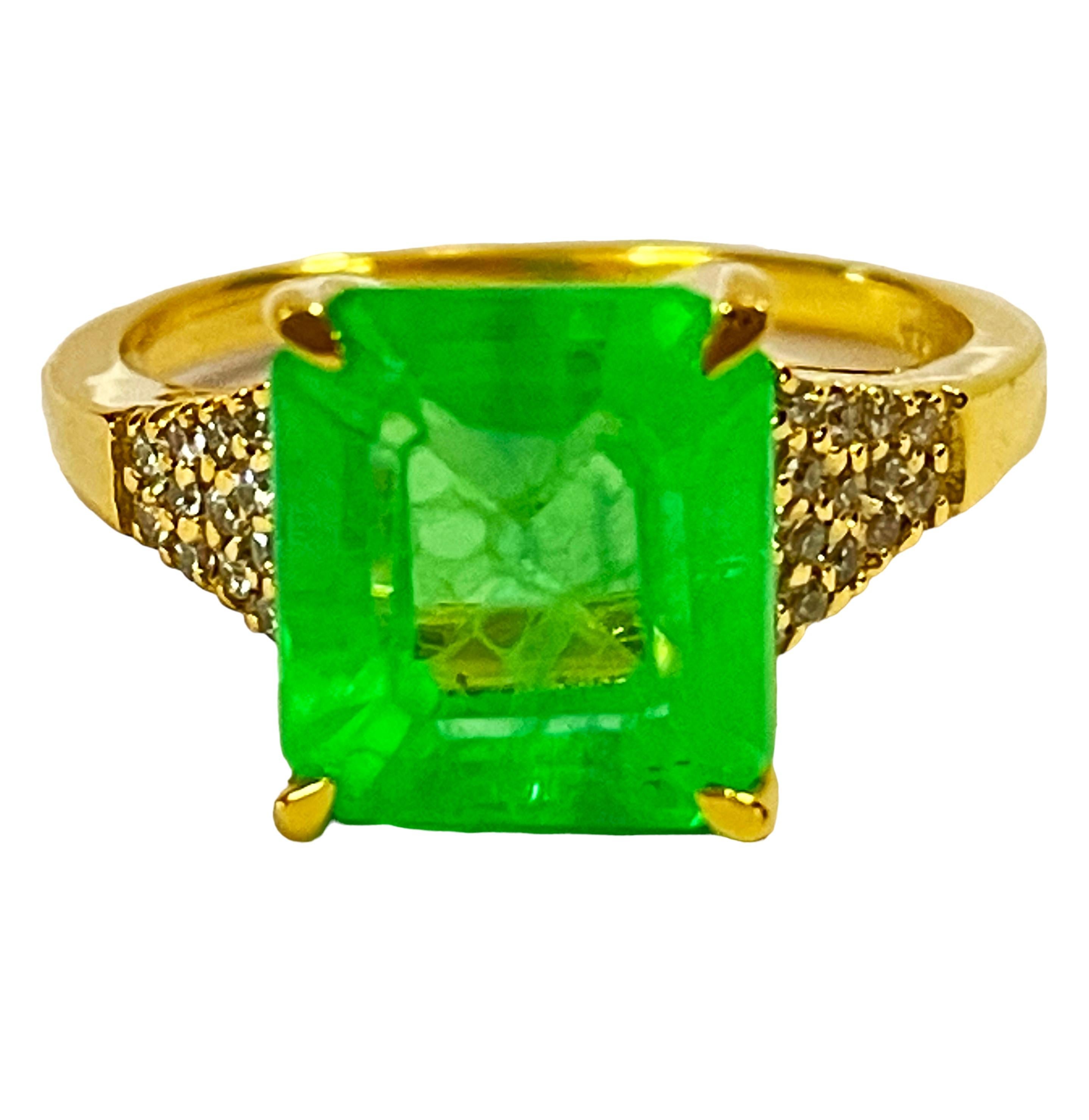 What beautiful color this ring is!  The setting is Yellow Gold Plated.  The ring is a size 6.75.   The stone is from Africa and is just exquisite.  It is a highly rated stone.  It is a cushion cut stone and is 5.40 Cts   The main stone is 9.7 x 8.7