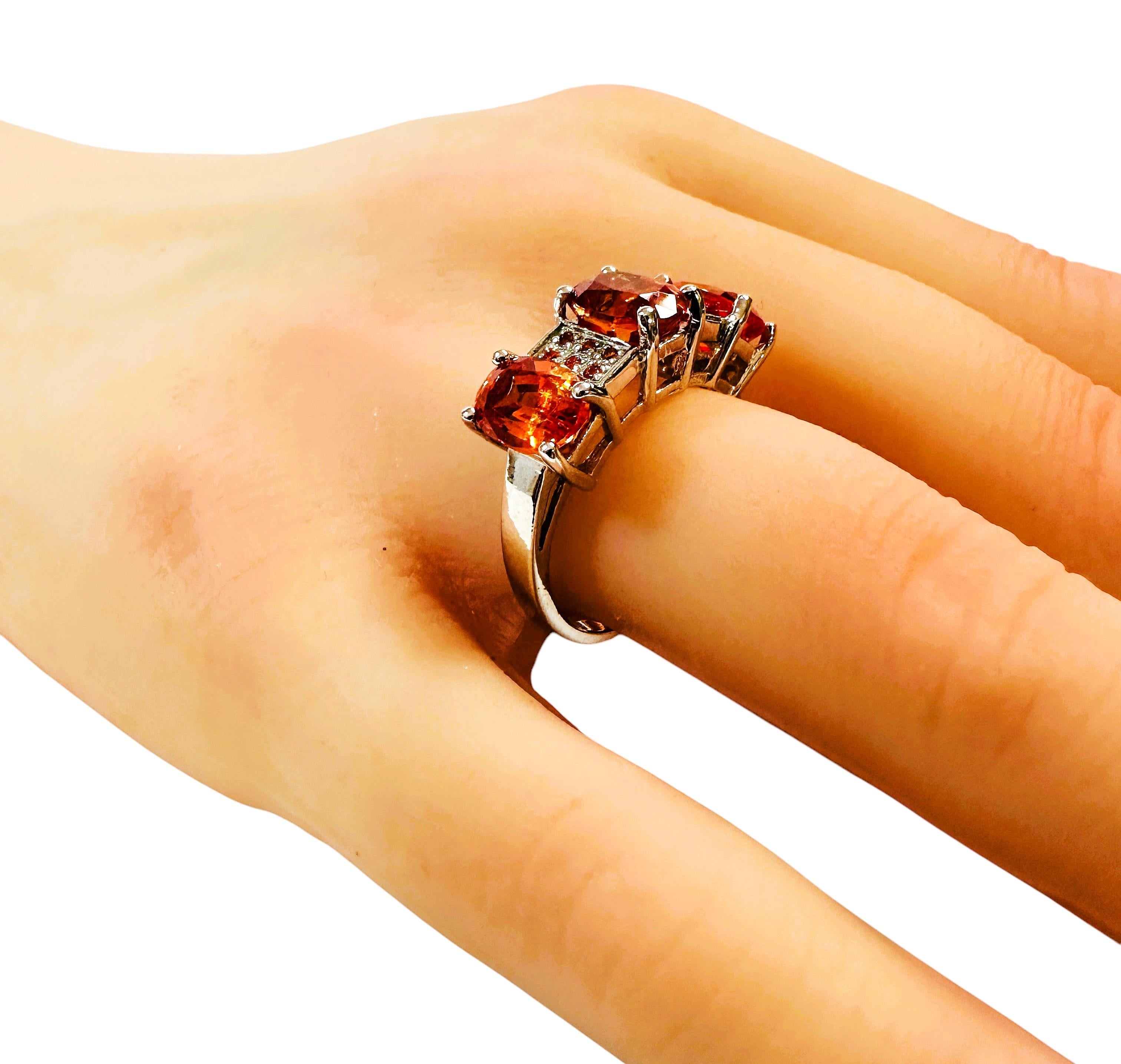 What beautiful stones are in this ring!  The ring is a size 7.  The 3 fancy oval cut stones are from Africa and is just exquisite.  They are highly rated stone.  They total 5.7 carats.  The 3 stones are 8 x 6 mm and in between them are beautiful