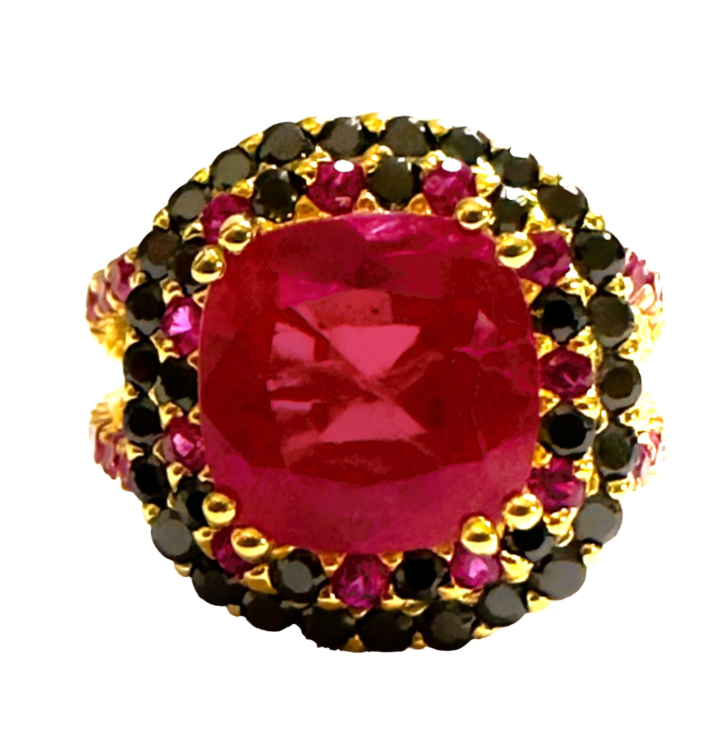 What a beautiful combination of colors in this ring.  The ring is a size 6.5.  It from Africa and is just exquisite. It is a cushion cut and is 5.80 Ct   The main stone is 9.8 mm. It has a beautiful diamond cut Pink Sapphire and Black Spinel stones