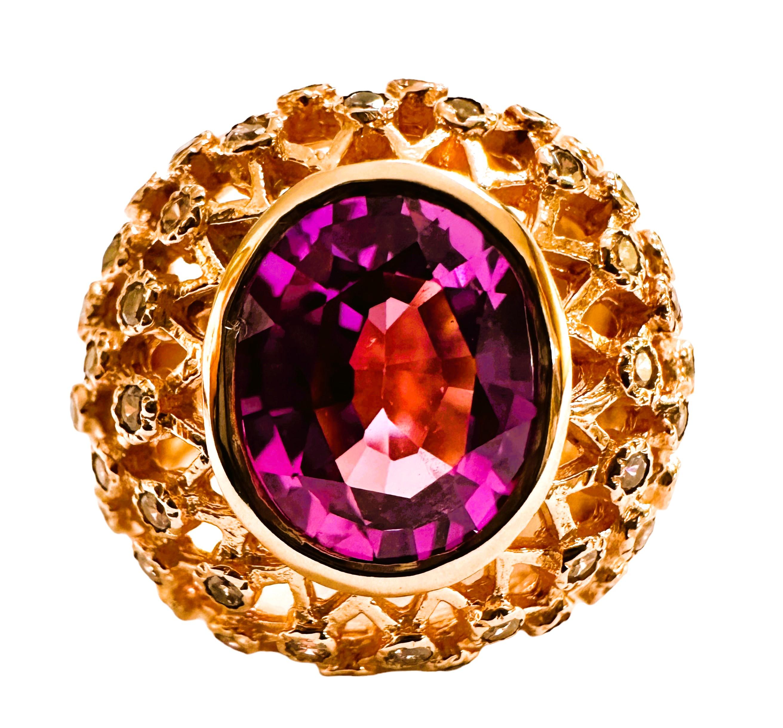 This is just a beautiful gemstone. This beautiful stone has pinks, blues and purples in it.  It's just spectacular.  The ring is a size 6.5.  It was mined in Africa and is just exquisite.   A very high quality stone. It is an oval cut stone and is