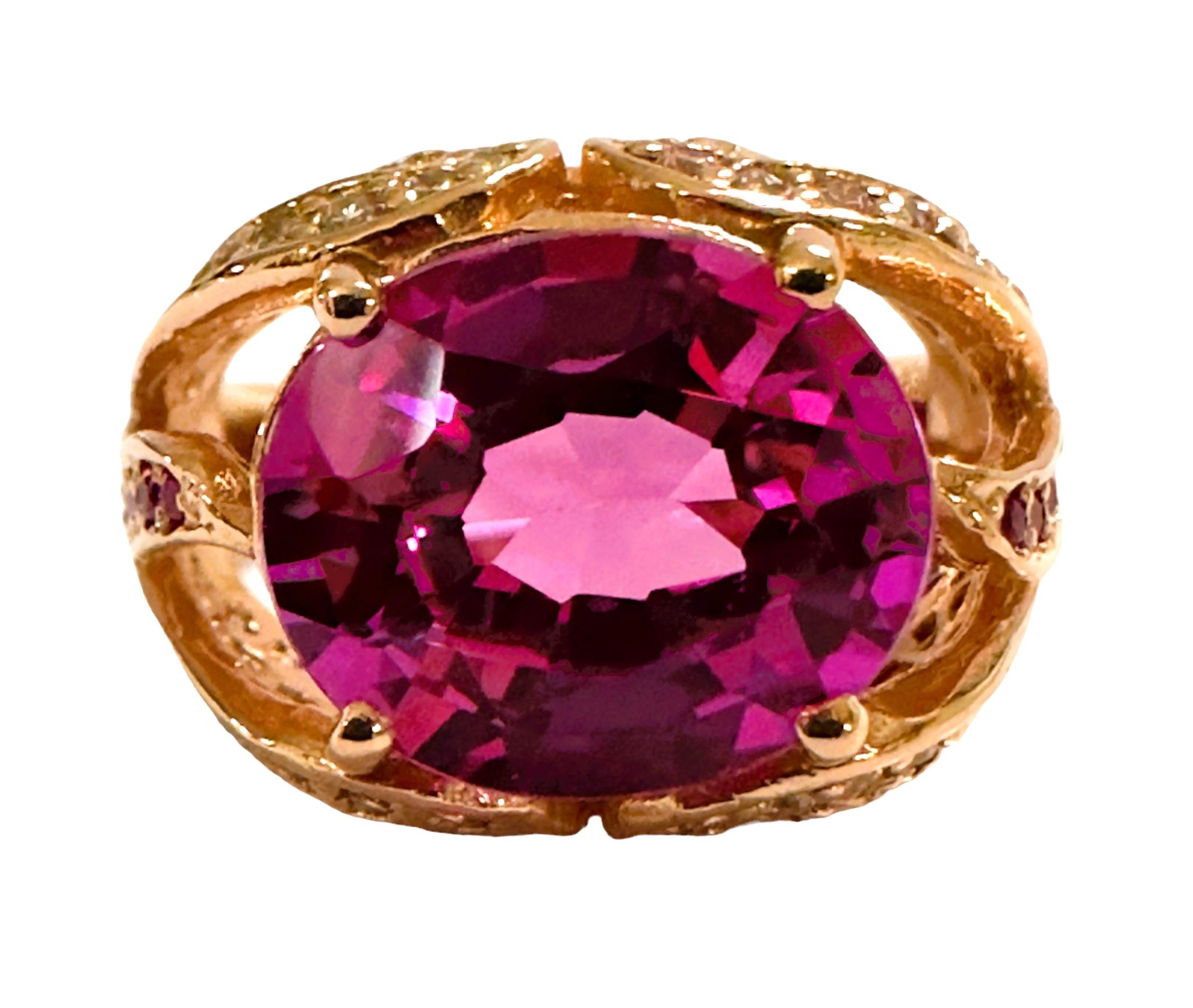 This is just a beautiful gemstone. This beautiful stone has pinks, blues and purples in it.  It's just spectacular.  The ring is a size 6.75.  It was mined in Africa and is just exquisite.   A very high quality stone. It is an oval cut stone and is