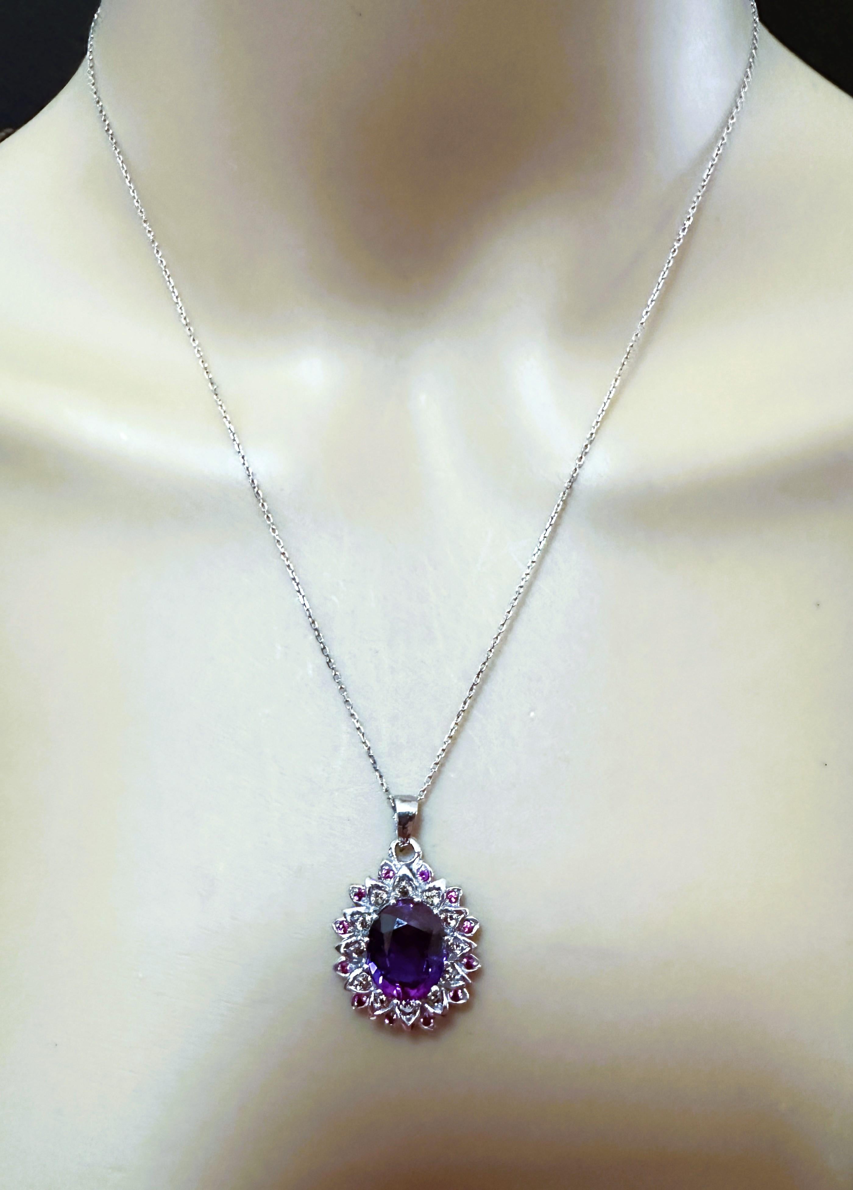 The stones are from Africa and is just exquisite. The main stone is a color changing blue/purple sapphire and is 6.25 cts.  The stone is an oval cut stone and measures 12 x 10 mm and is surrounded by diamond cut champagne sapphires and then smaller