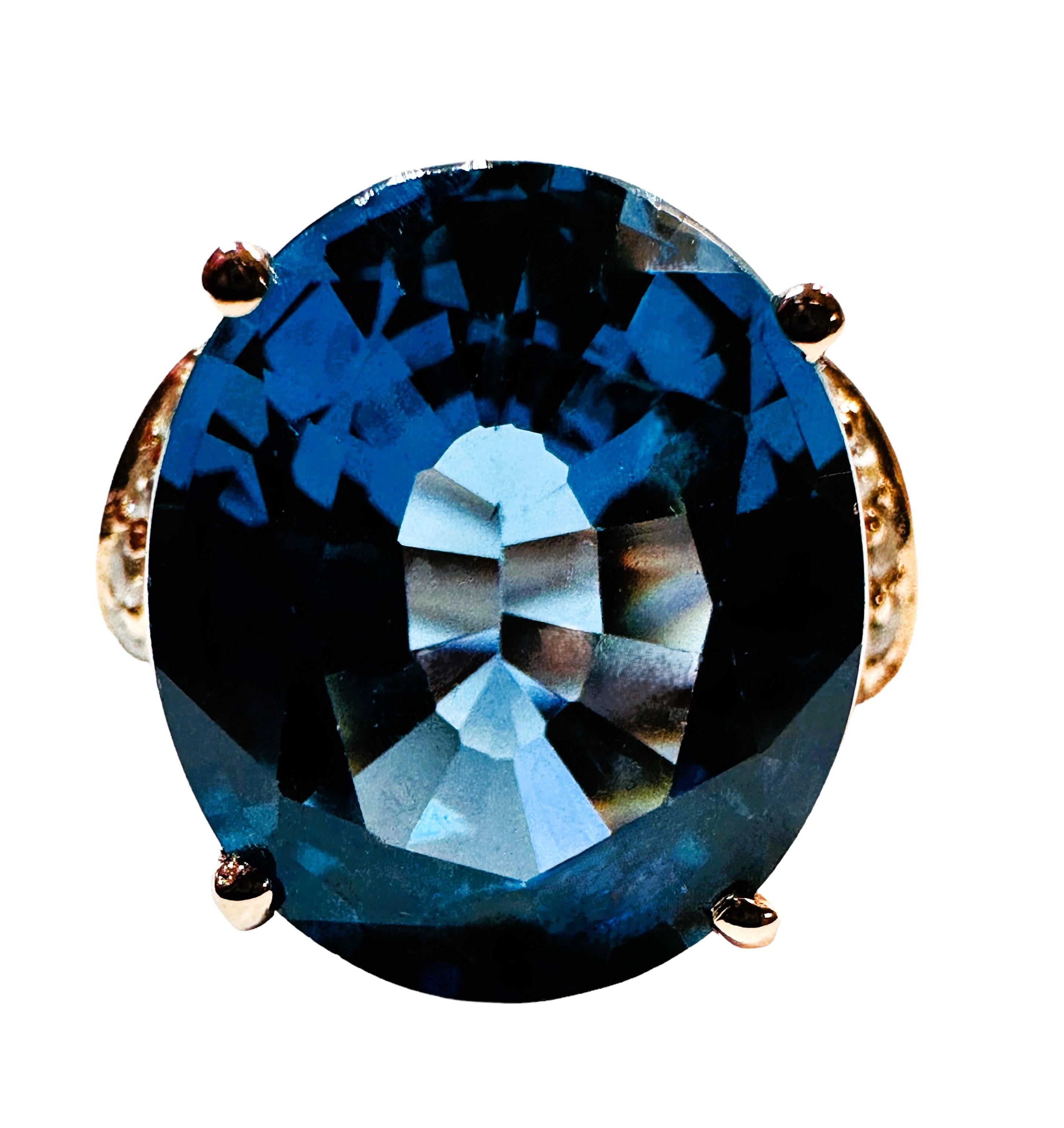 I love the color and cut of this stone.  It is just so brilliant.  The ring is a size 6.5.  The stone is from Africa and is just exquisite.  It is a fancy cut oval stone and is 9.30  Cts.   The main stone is 14.3 x 12.2 mm and it has diamond cut