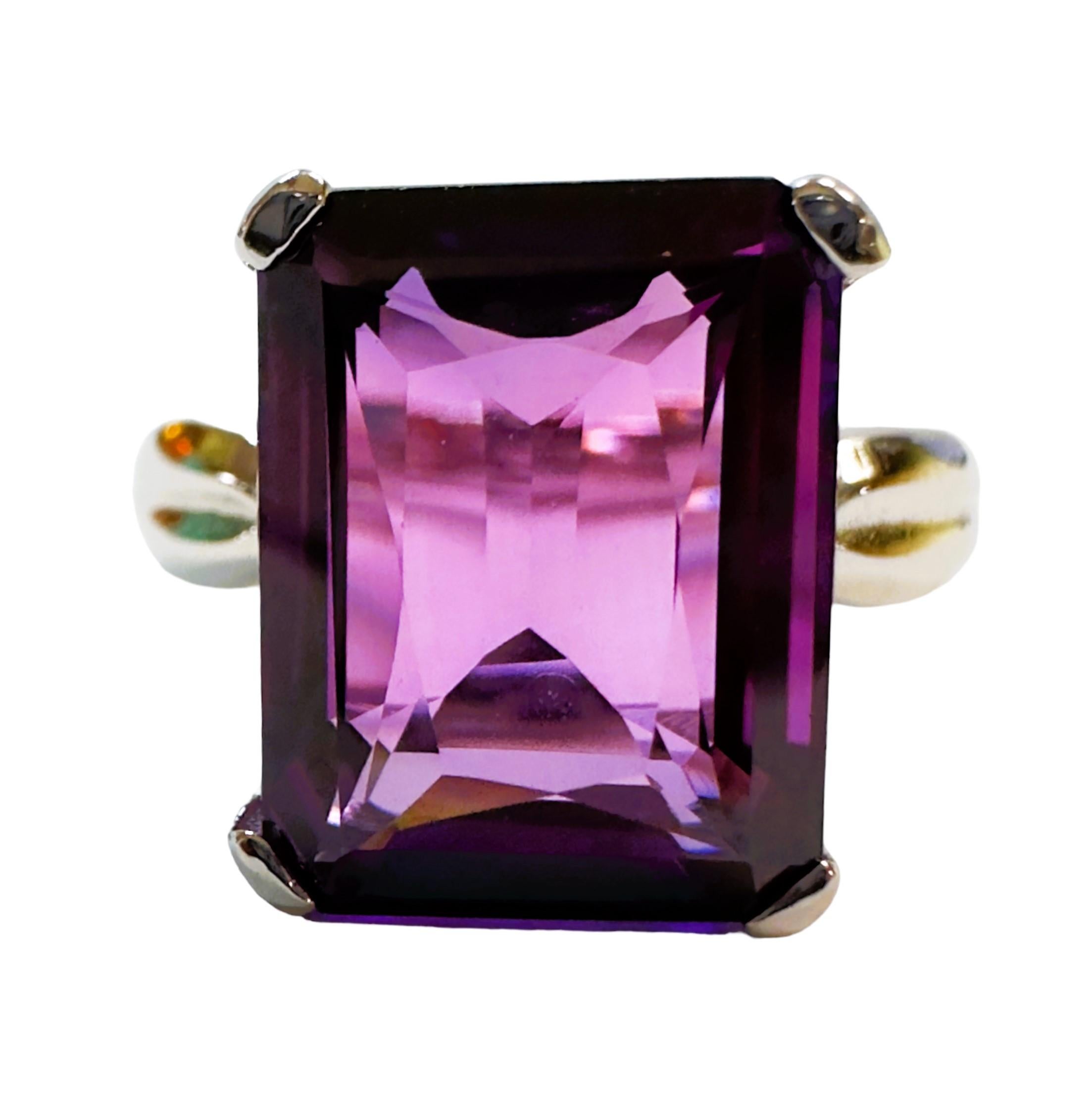 I love this ring for the simplicity and the cut of the stone.  The ring is a size 6.5. This stone is from Africa.   It is a beautiful emerald cut stone and is 9.60 cts.  It's a very high quality stone.  It measures 13 x 10 mm.   It is a beautiful