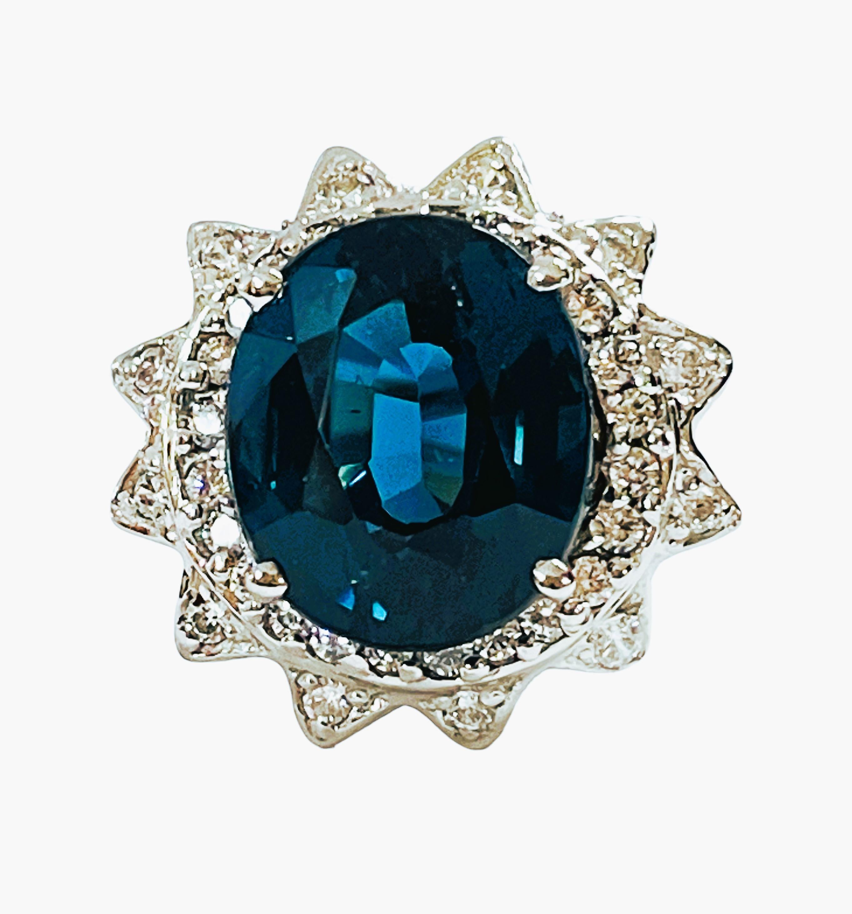 The ring is a size 5.75.  It's a beautiful statement ring and the stone is just stunning.  It's a deep blue teal color.  I don't believe I've had one in this stunning color before.   It's just beautifully cut.  It is 8.60 carats and measures 13 x