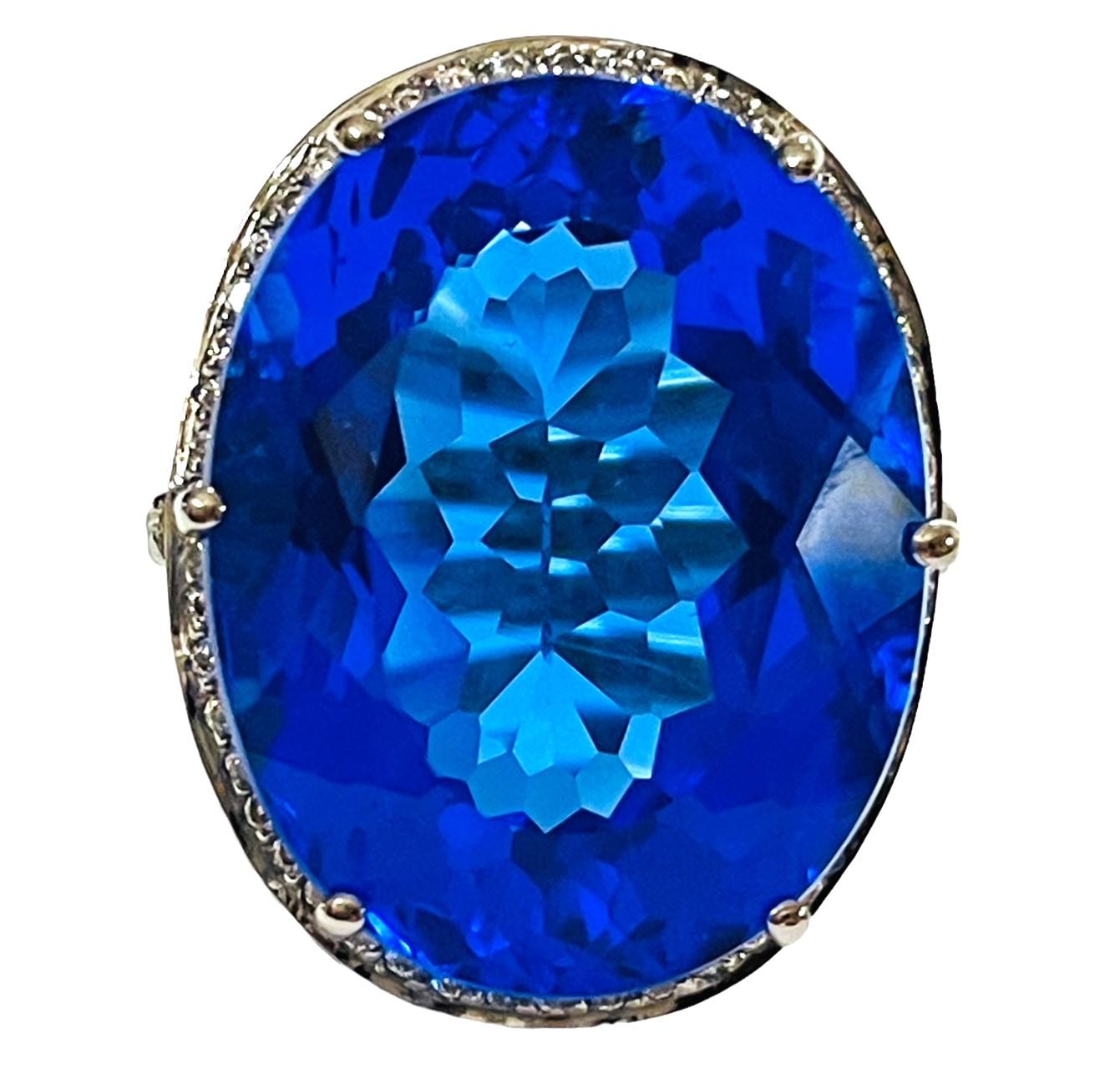 What a gorgeous eye-popping stone.  It is 21.50 Cts and measures 21.0 x 16.3 mm.  The color is so brilliant and it just sparkles and shimmers!   Sure to get noticed.  The weight in Grams is 8.21.   I have many items on auction that have matching