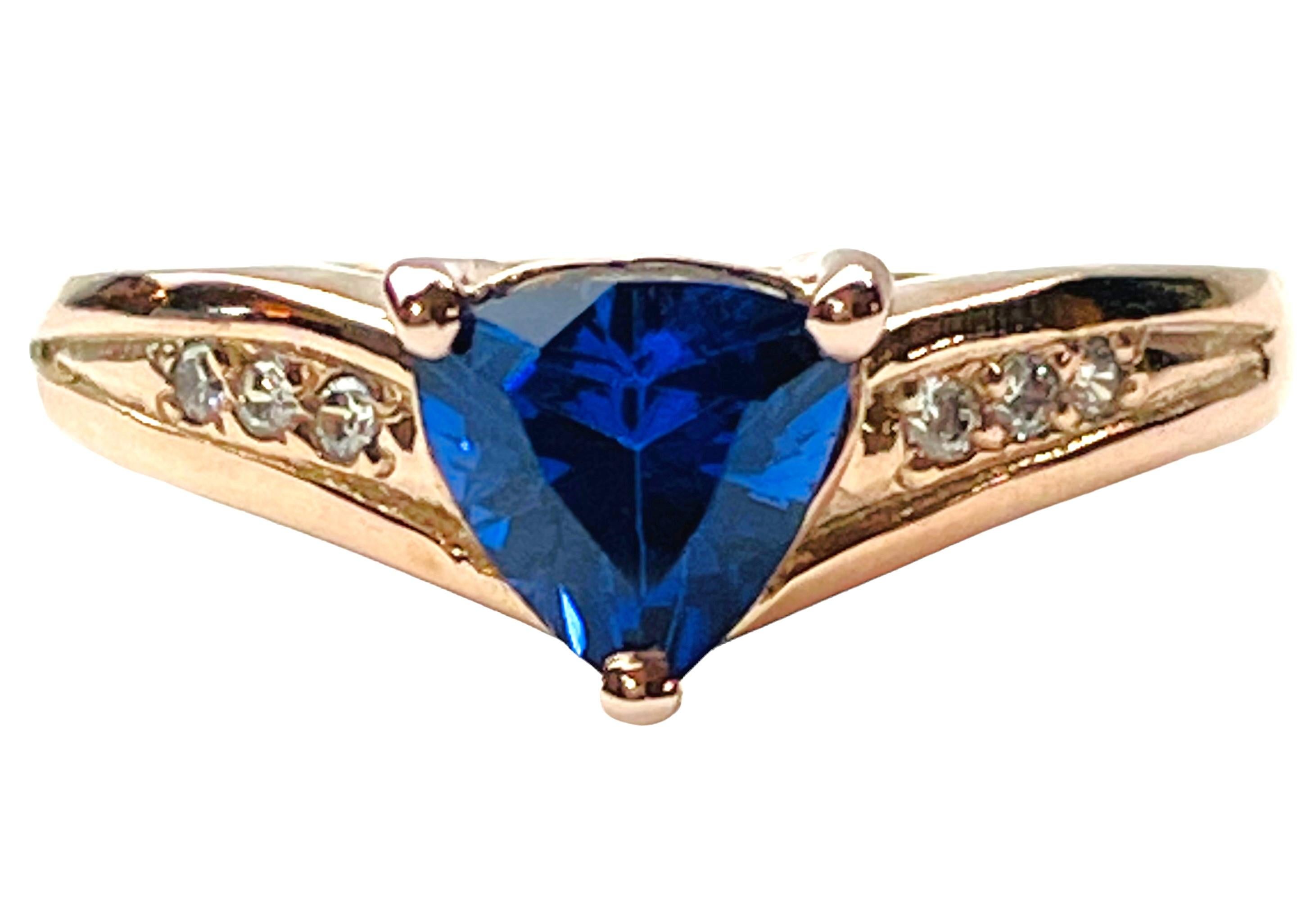 What a gorgeous ring this is.  It is a size 6.75.  The sapphire is from Africa and I love that it's a trillion cut.  It's a very high quality stone.  The 