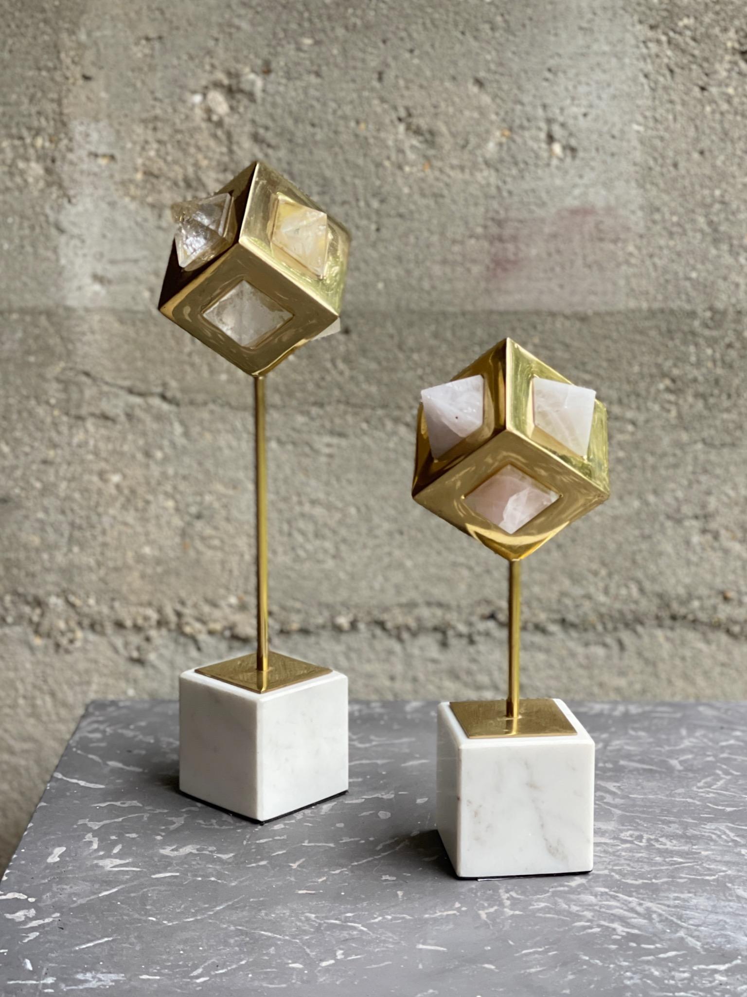 Pair of stunning 'New Age' Organic Modern sculptures with faceted natural rock crystal quart wrapped in solid  brass bezels on honed marble bases

These geometric sculptures  are comprised o two different  types of rock crystals, the taller 13