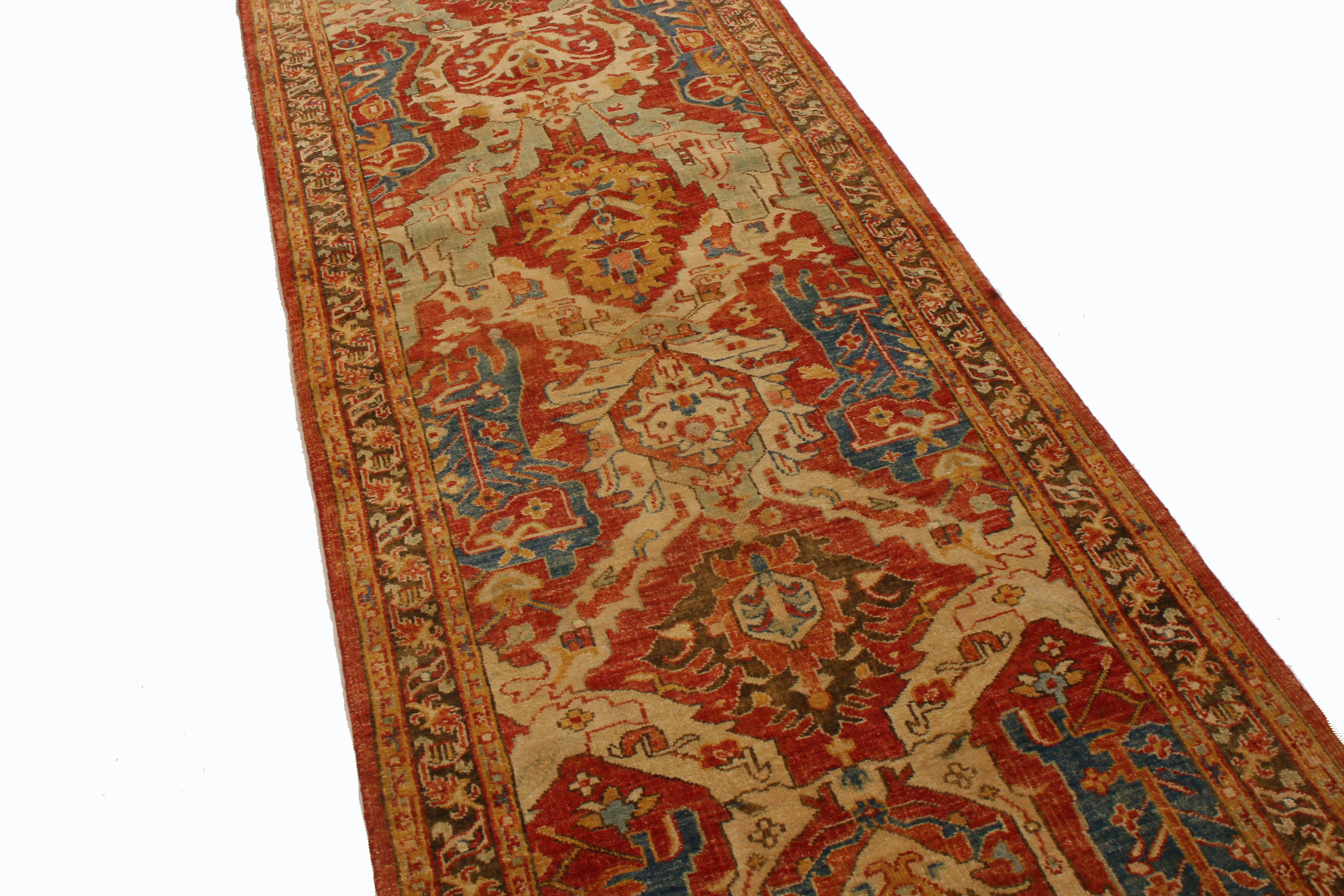Originating from India in the 2010s, this new Agra wool runner features interesting complementary symbols in its field design. Hand knotted in high-quality wool, the field design employs a vertically symmetrical tower of lotus, palmette, and tree