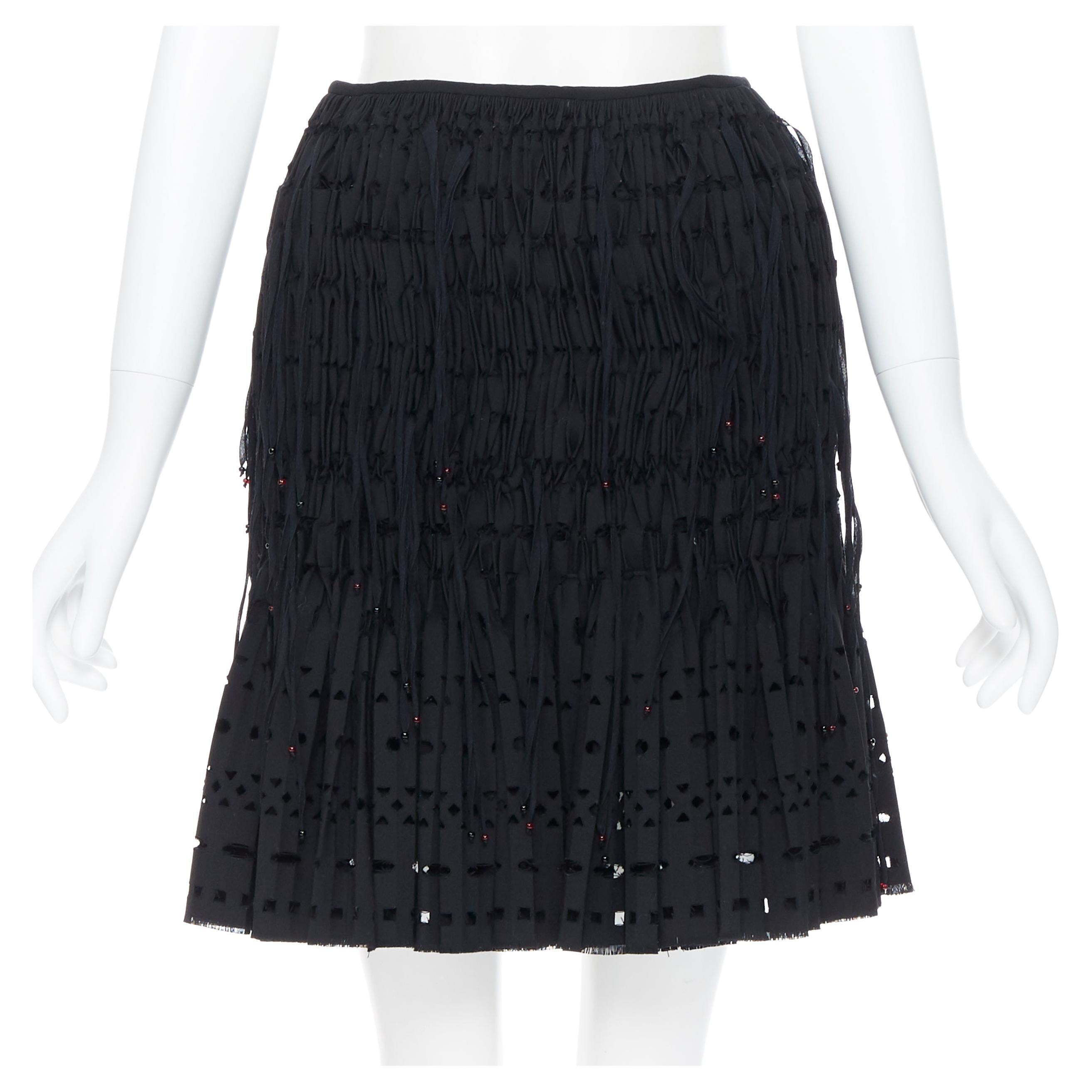new ALAIA black geometric cut out pleated shirred red bead fringe skirt FR38 For Sale