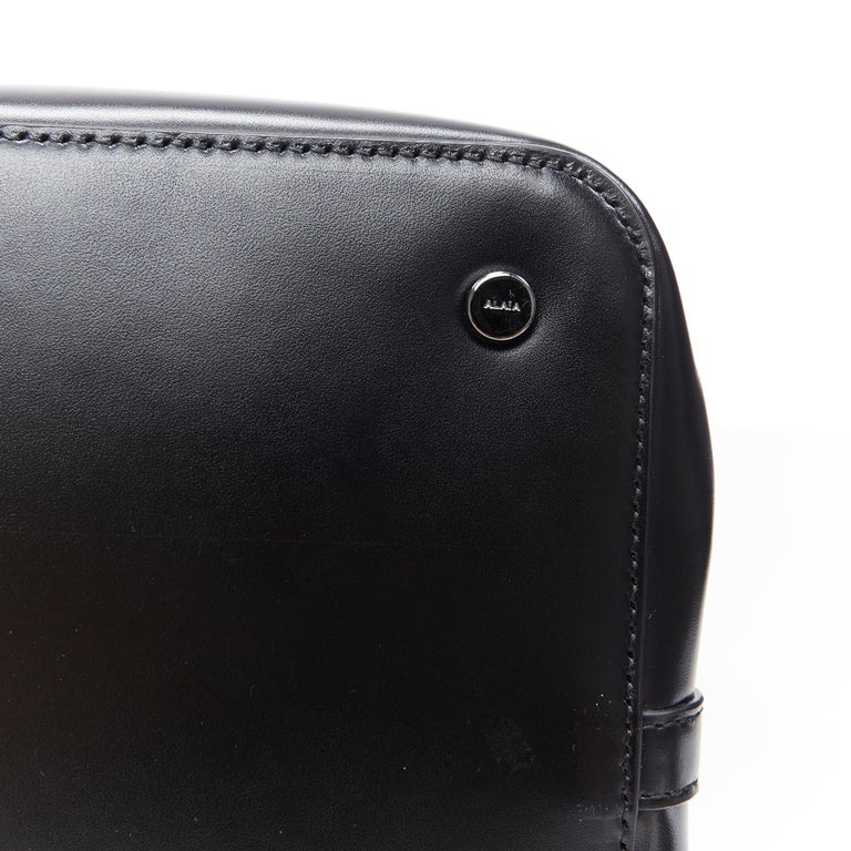 new ALAIA black leather gunmetal grommet punctured expandable large ...