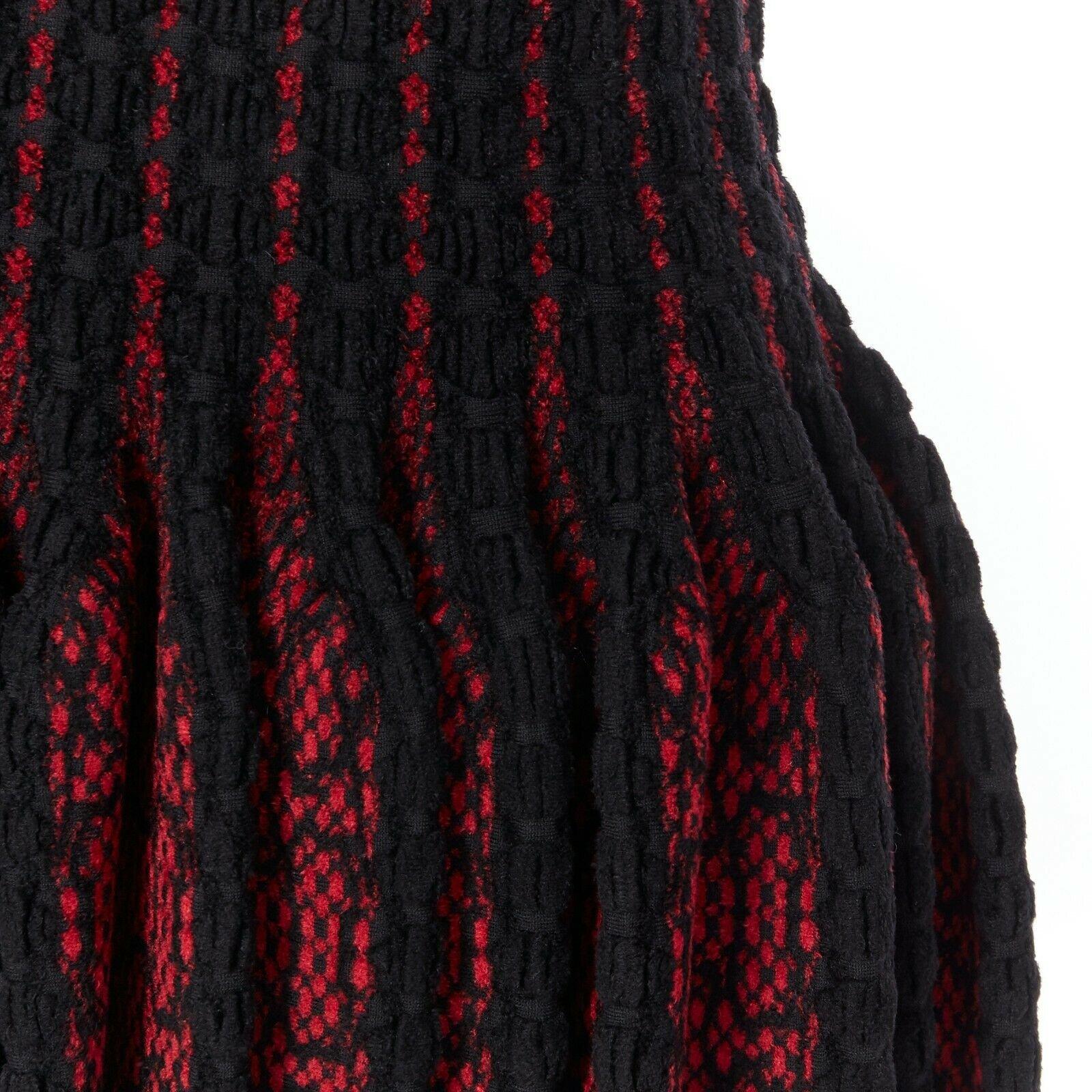 new ALAIA black red fleece wool geometric knit jacquard fit flare dress FR42 L 
Reference: TGAS/A03456 
Brand: Alaia 
Designer: Azzedine Alaia 
Material: Viscose 
Color: Black 
Pattern: Floral 
Closure: Zip 
Extra Detail: V-neck. Sleeveless.