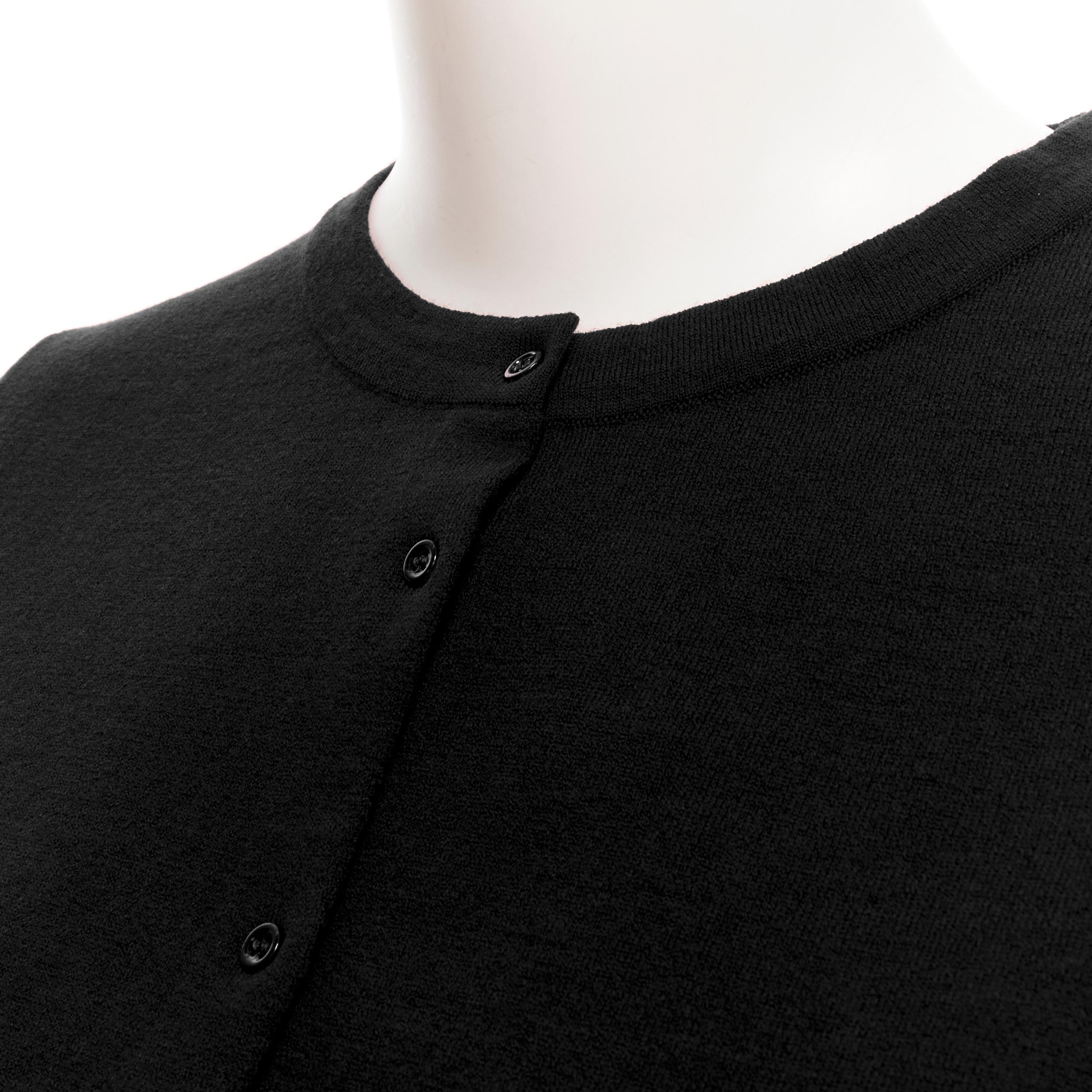 new ALAIA Signature cropped wool knit button cardigan Noir black FR44 XL 
Reference: TGAS/B01925 
Brand: Alaia 
Designer: Azzedine Alaia 
Collection: Permanent 
Material: Wool 
Color: Black 
Pattern: Solid 
Closure: Button 
Extra Detail: An Alaia