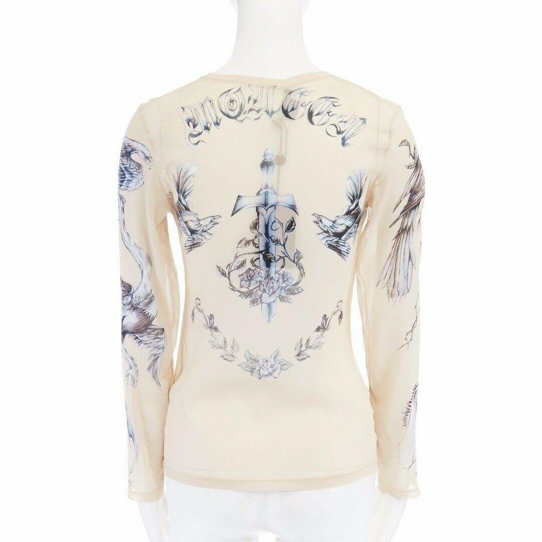 new ALEXANDER MCQUEEN 2008 sheer nude skull tattoo printed silk top IT38 XS

ALEXANDER MCQUEEN
FROM THE 2008 COLLECTION
Silk . Nude semi sheer base . 
Grey tattoo printed throughout . 
Round necklien . Long sleeve . 
Tonal stitching . Stretch fit .