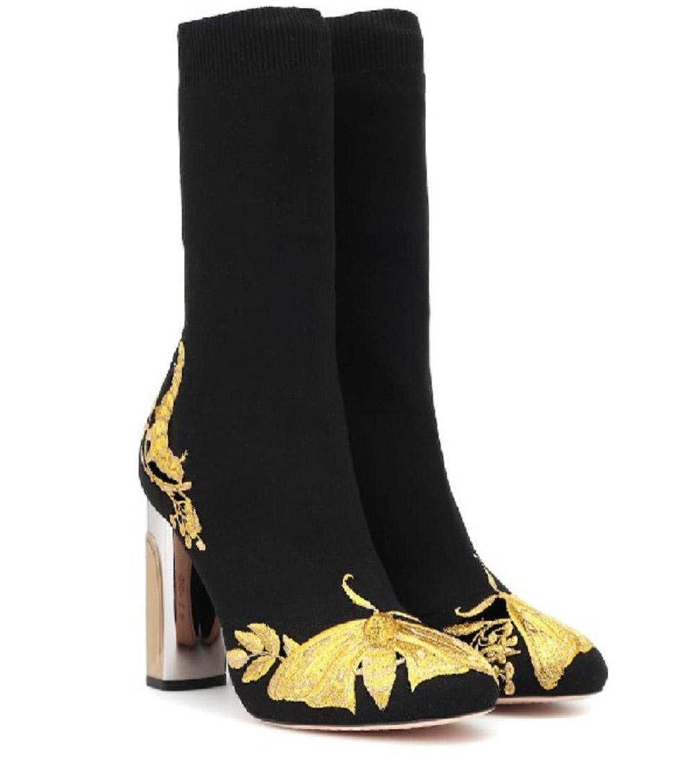 Alexander McQueen - Imbued with the romantic narrative that typifies Alexander McQueen's Autumn/Winter 2018 collection.
Sarah Burton's forever muse, nature, is wonderfully translated in Alexander McQueen's black knitted ankle boots. This sock-like