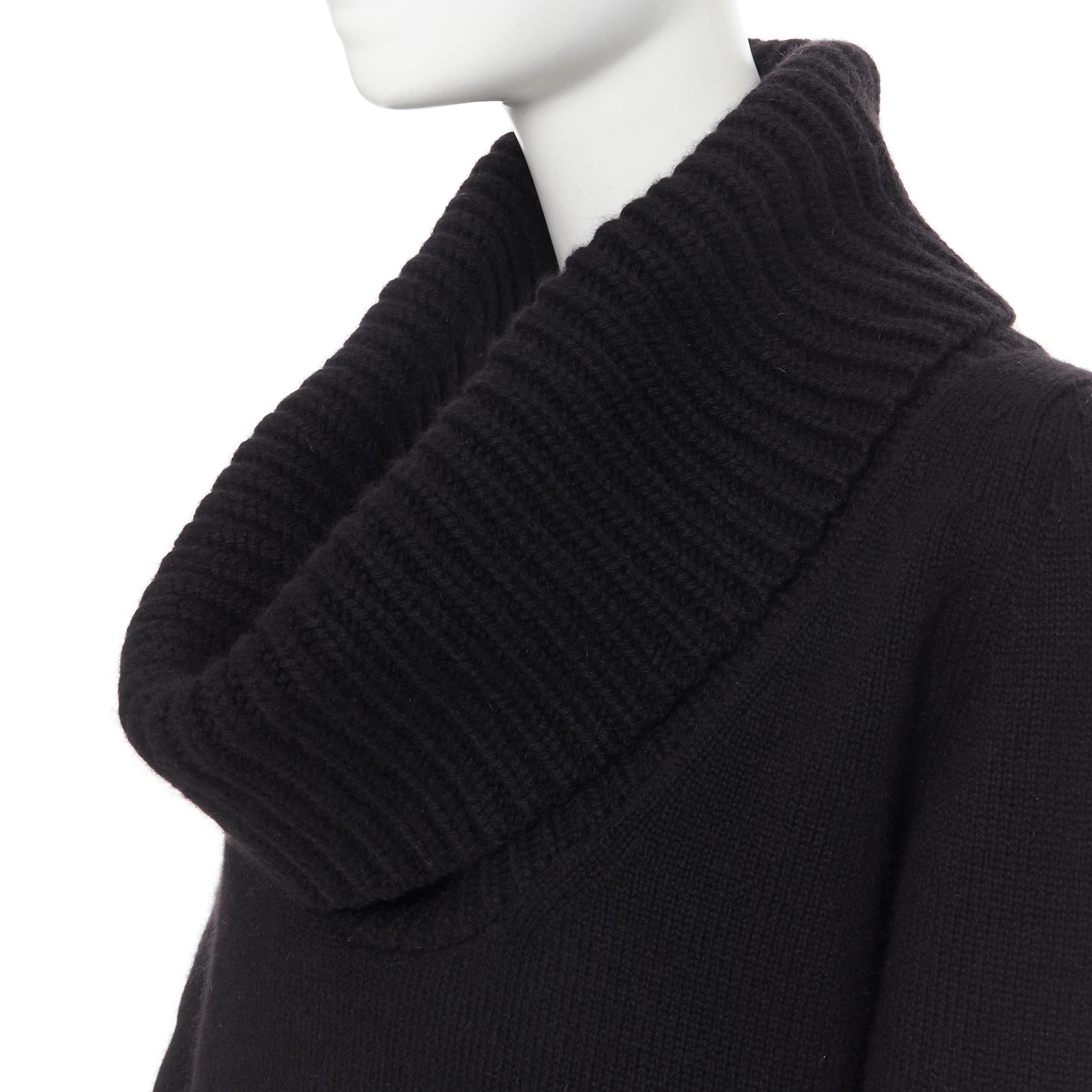 new ALEXANDER MCQUEEN black wool angora blend ribbed turtleneck sweater S 
Reference: AEMA/A00037 
Brand: Alexander McQueen 
Material: Angora 
Color: Black 
Pattern: Solid 
Extra Detail: Ribbed shawl turtleneck collar. Long sleeves. 
Made in: Italy