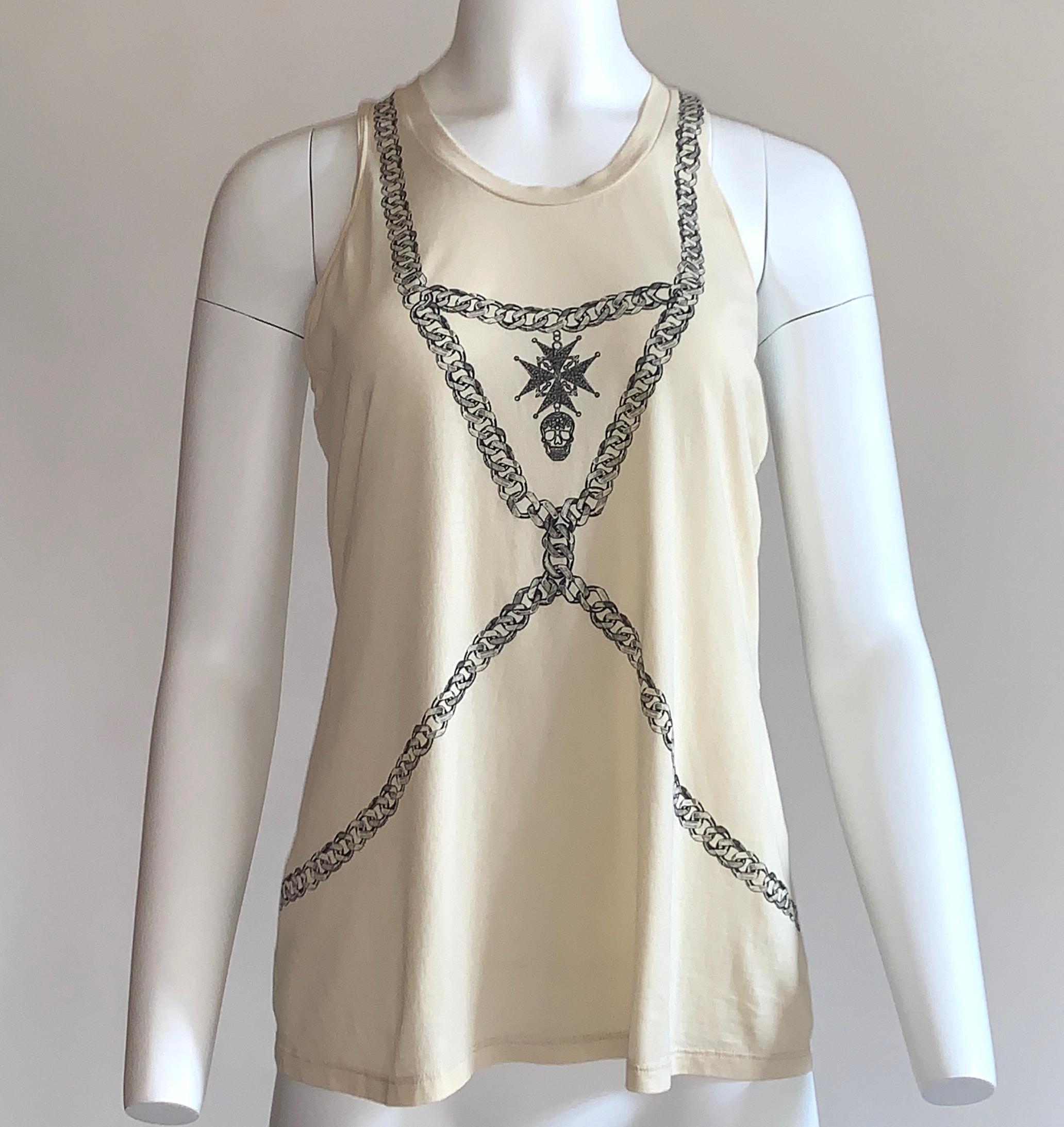 Alexander Mcqueen 2015 cream t-shirt tank featuring chain harness print, with printed Maltese cross and skull at front. Cool twist detailing at racerback. 

100% cotton.

Made in Italy.

Size IT 40, approximate US 4. See measurements.
Bust (underarm
