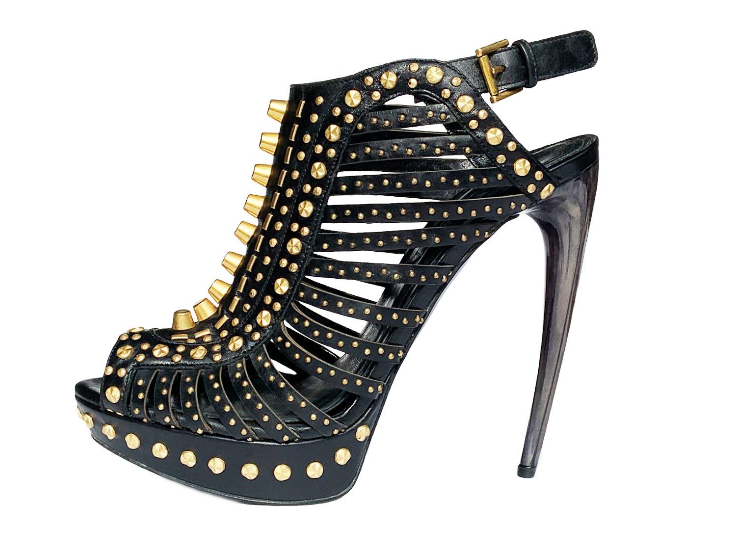 Alexander McQueen Black Leather Studded Cage Platform Sandals
S/S 2012 Collection
Italian size - 38.5 ( US 8.5)
The perfect amount of luxury, elegance, strength and severity. Adorned with gold-tone hardware, a concave stiletto horn heel, enough