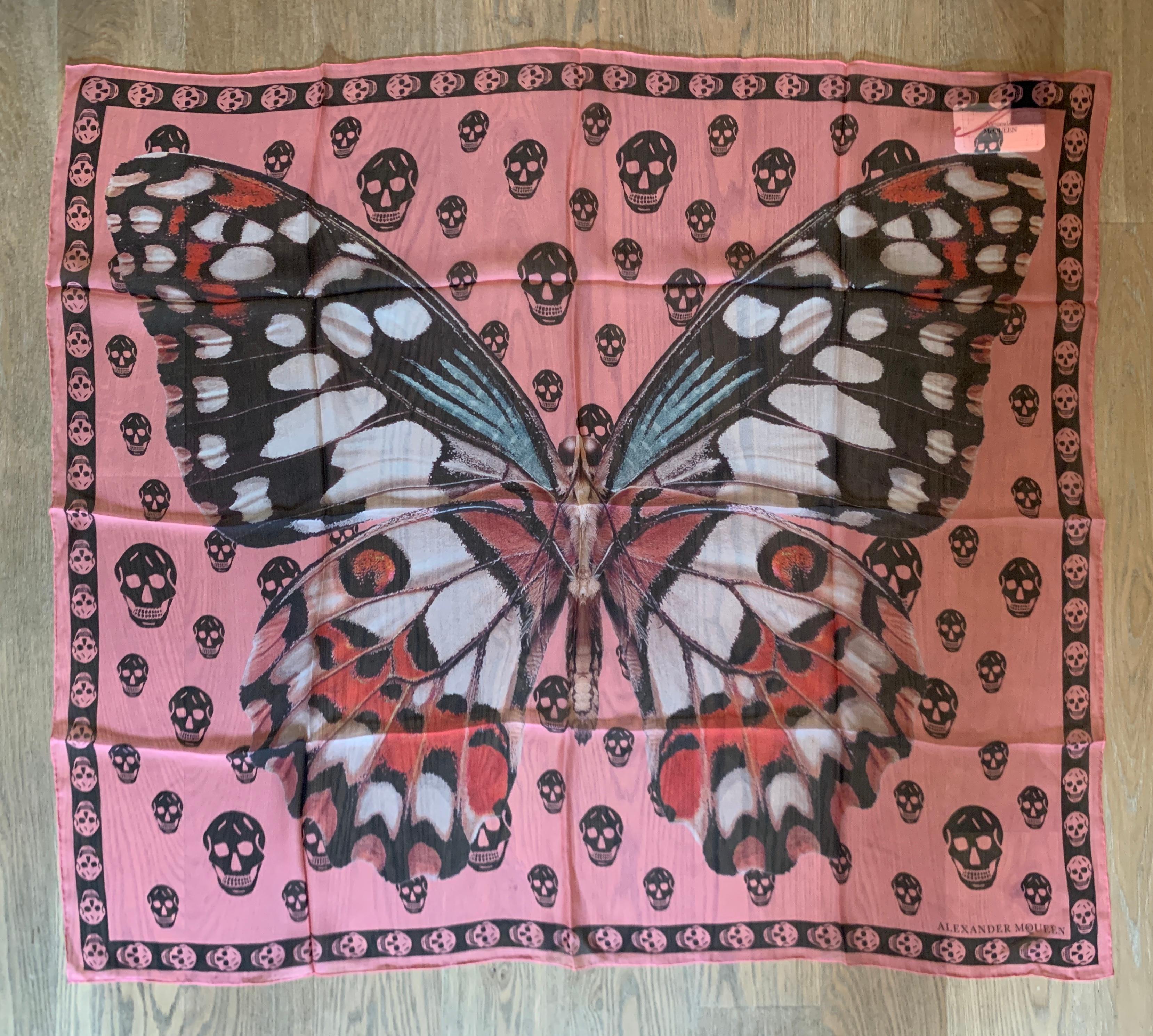 New Alexander McQueen large semi-sheer scarf featuring giant butterfly or moth with black skull print throughout background. Signed Alexander McQueen in logo at bottom corner. 

Purchased directly from McQueen store.

100% silk.

Approximately 41