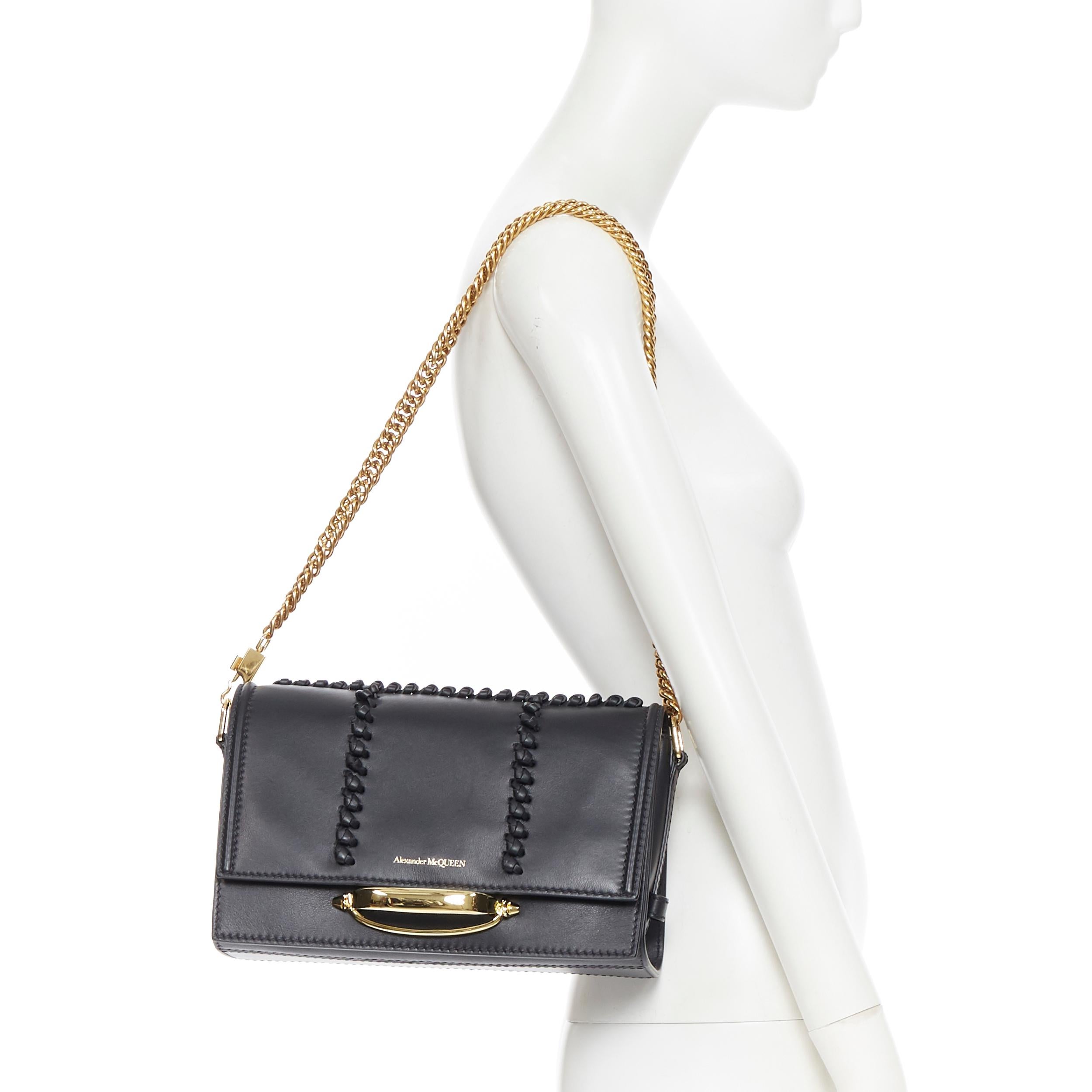 new ALEXANDER MCQUEEN The Story black leather whipstitch gold knuckle chain bag 
Reference: MAWG/A00034 
Brand: Alexander McQueen 
Model: The Story 
Material: Leather 
Color: Black 
Pattern: Solid 
Closure: Magnetic 
Extra Detail: Black leather