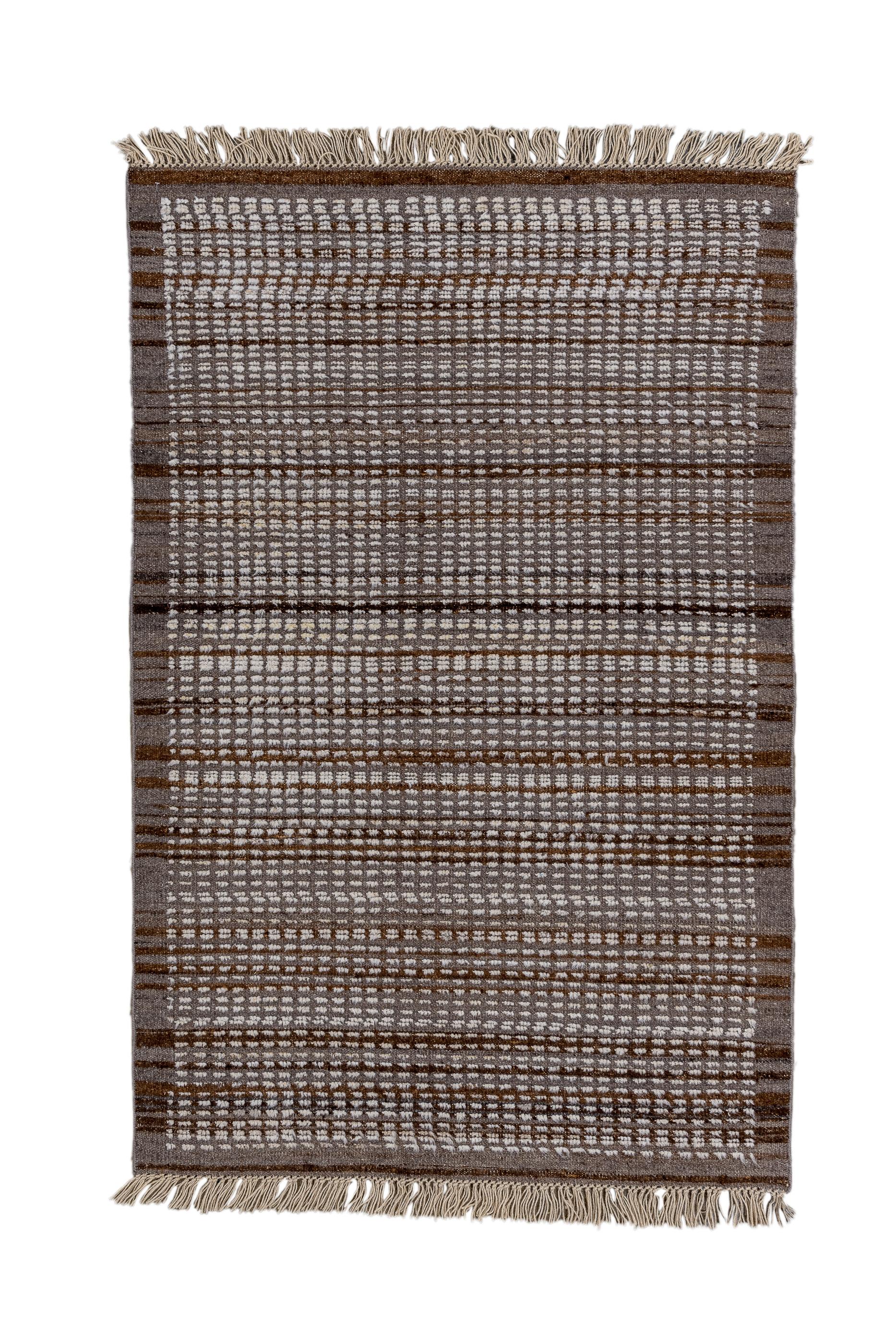 This coarse weave village piece shows an irregular allover design of ecru dashes in a conforming small, rectangular lattice, giving a ribbed over pattern. Dark brown medium width border. All wool. An authentic, easy to live with rug with plenty of