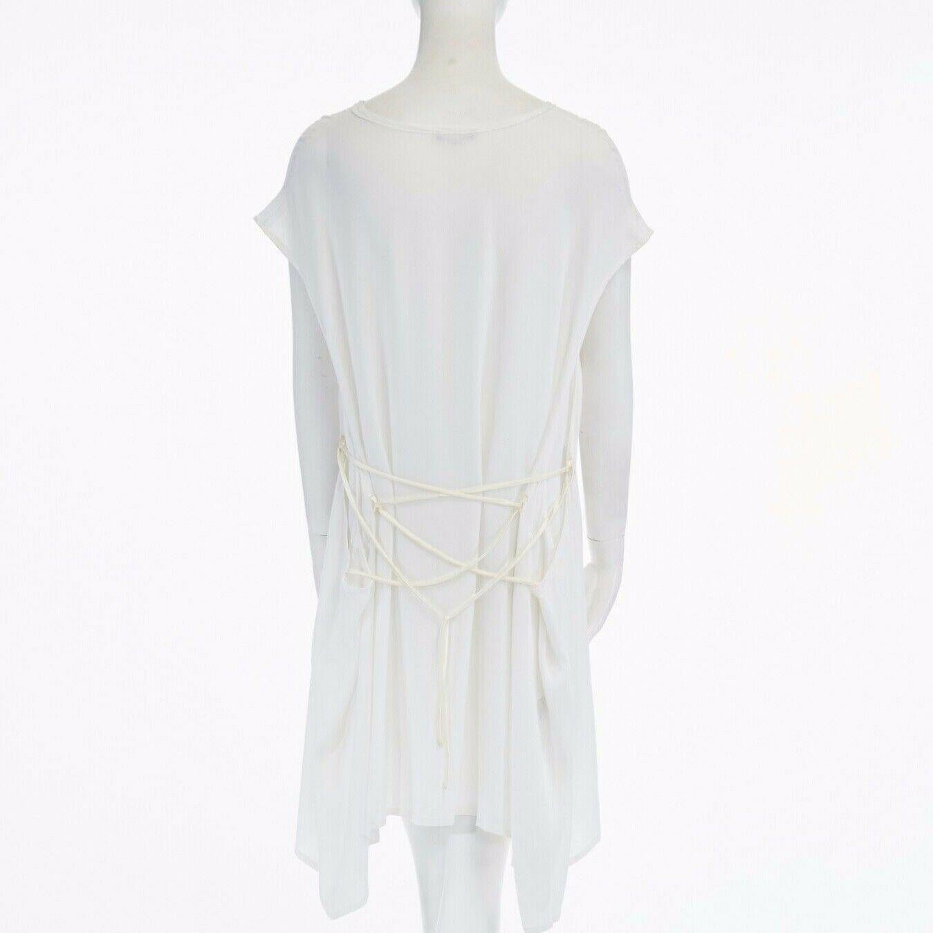 new ANN DEMEULEMEESTER white rayon tie back loose fit teeshirt dress FR34 US2 S
ANN DEMEULEMEESTERFROM THE SPRING SUMMER 2015 COLLECTION
RAYON, VISCOSE. WHITE. CAP SLEEVES. WIDE NECKLINE. FRAYED DETAIL ALONG NECKLINE. 
DROPPED ARMHOLE. ATTACHED TIE