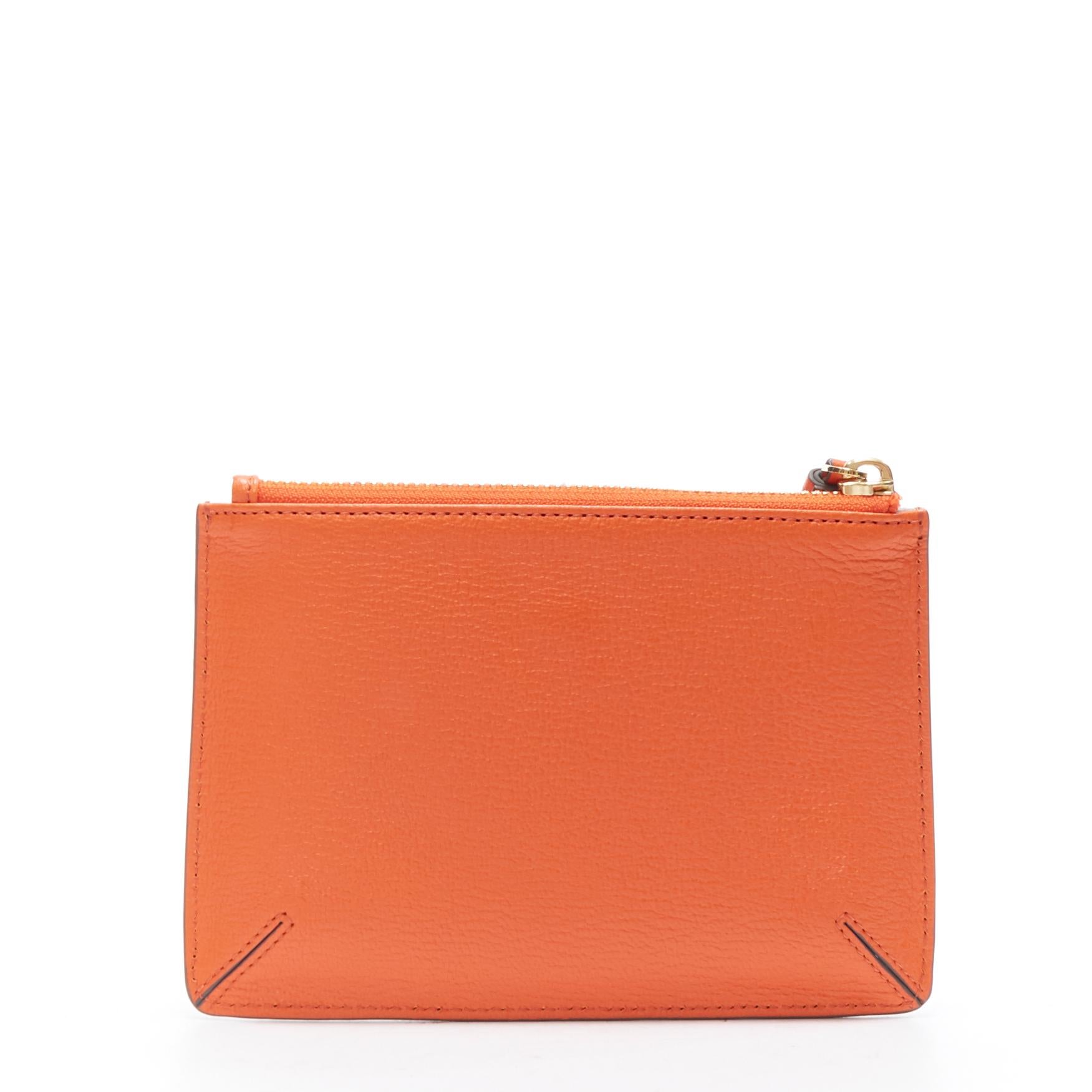new ANYA HINDMARCH Ouch bandage orange leather top tassel zip pouch bag 
Reference: LNKO/A01235 
Brand: Anya Hindmarch 
Designer: Anya Hindmarch 
Material: Leather 
Color: Orange 
Pattern: Solid 
Closure: Zip 
Made in: Italy 

CONDITION: 
Condition:
