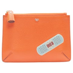 new ANYA HINDMARCH Ouch bandage orange leather top tassel zip pouch bag