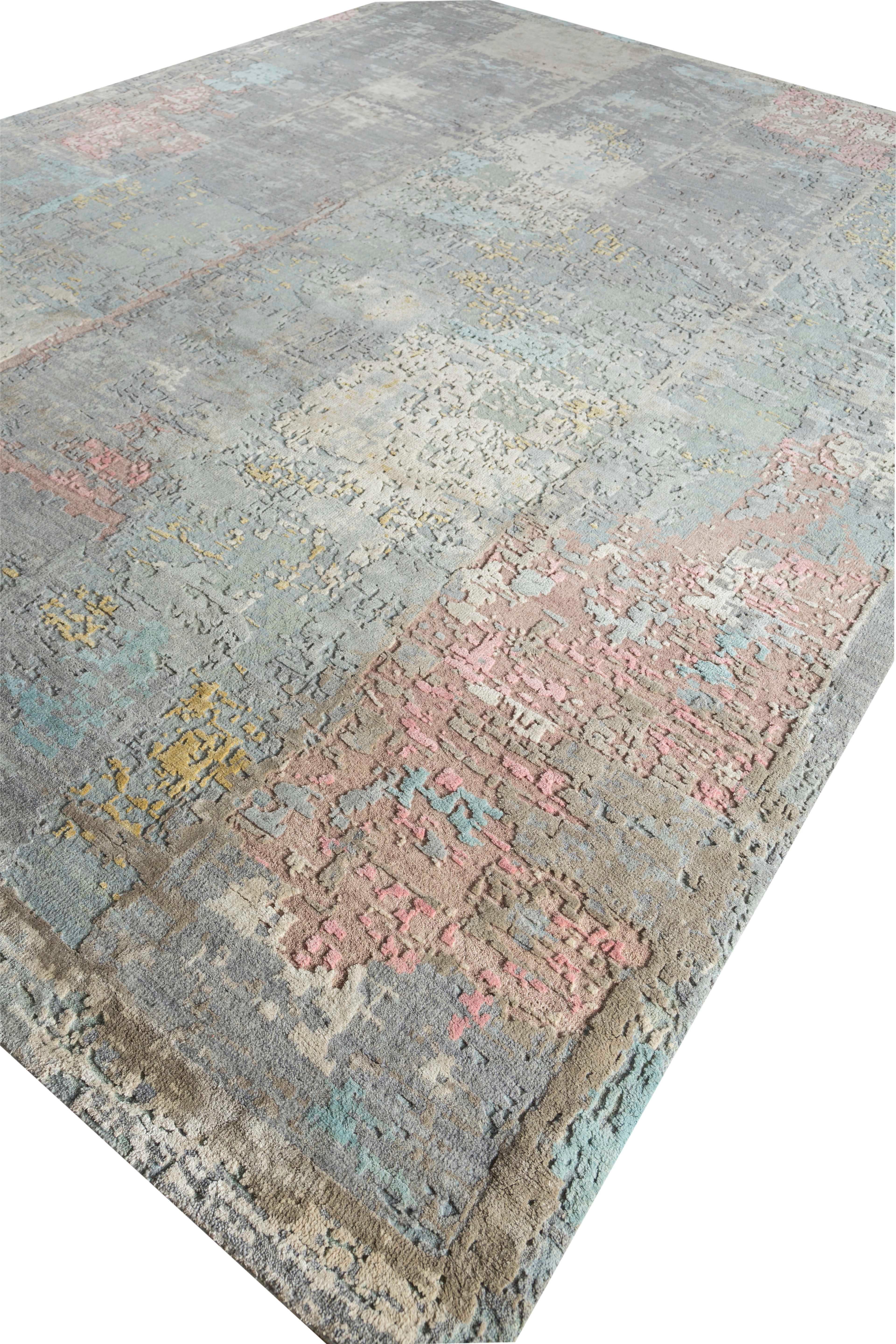 New area rug handwoven from the finest sheep’s wool and real silk. It’s colored with all-natural vegetable dyes that are safe for humans and pets. It features beautiful modern watercolor art design patterns that blend perfectly with contemporary
