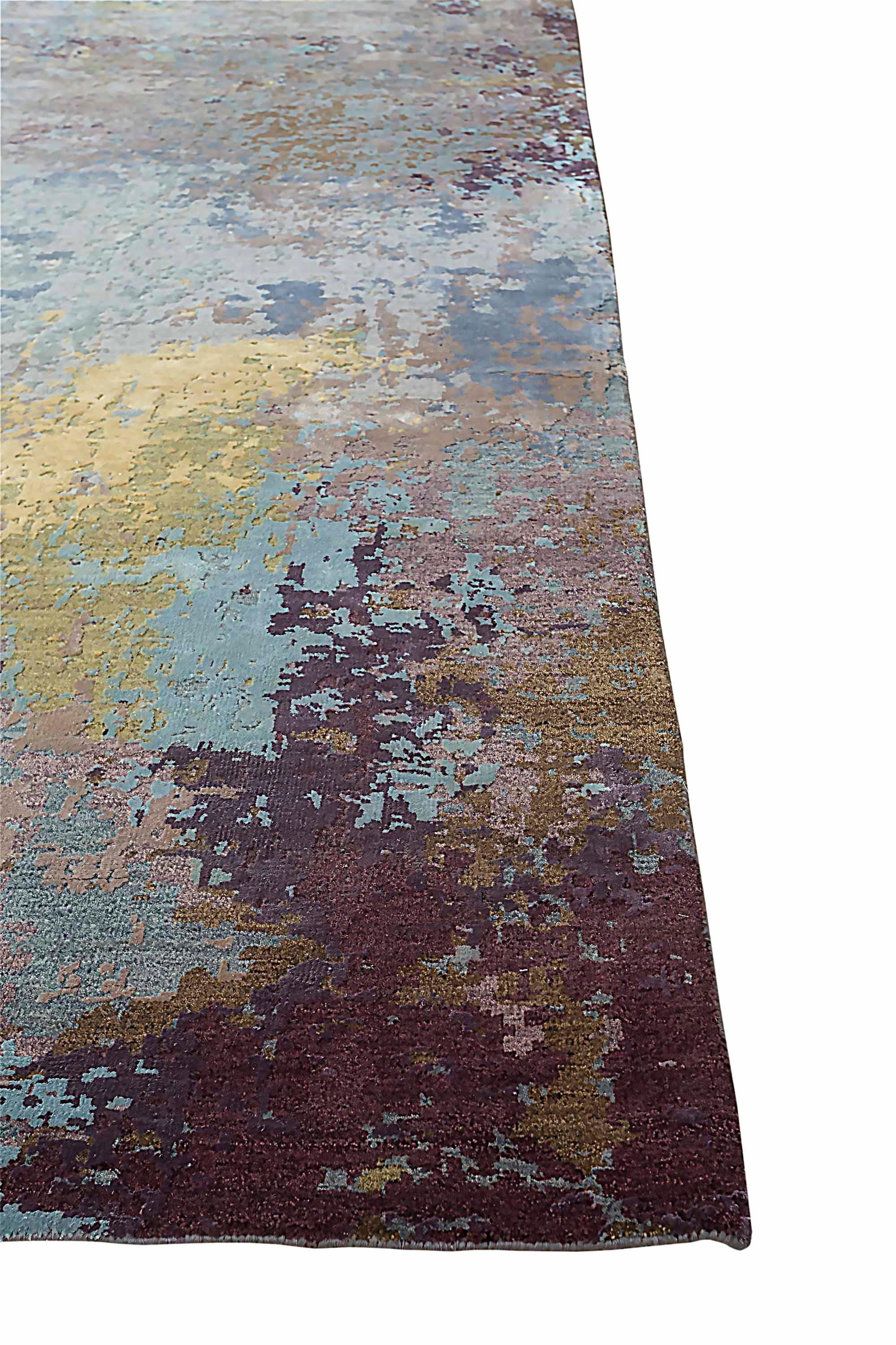 New area rug handwoven from the finest sheep’s wool and real silk. It’s colored with all-natural vegetable dyes that are safe for humans and pets. It features beautiful modern watercolor art design patterns that blend perfectly with contemporary