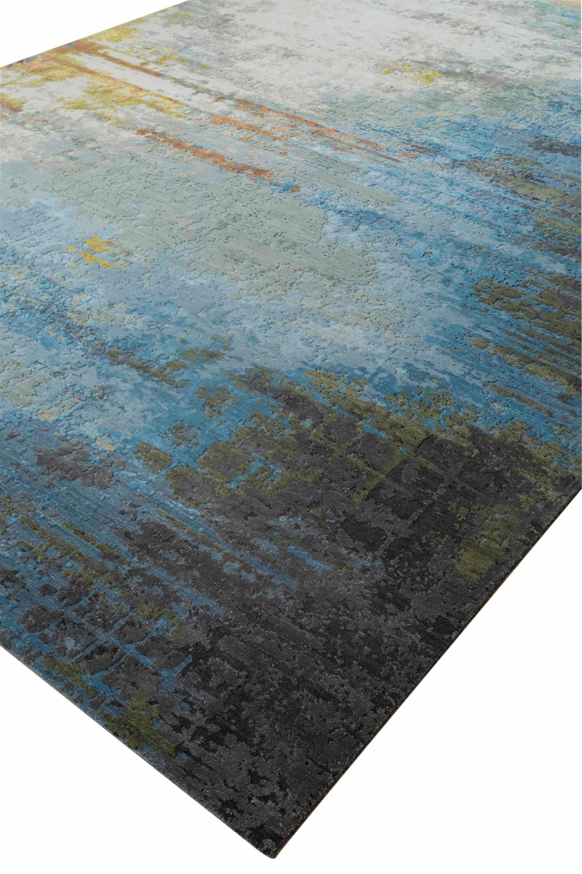 New area rug handwoven from the finest sheep’s wool and real silk. It’s colored with all-natural vegetable dyes that are safe for humans and pets. It features beautiful modern watercolor art design patterns that blend perfectly with contemporary