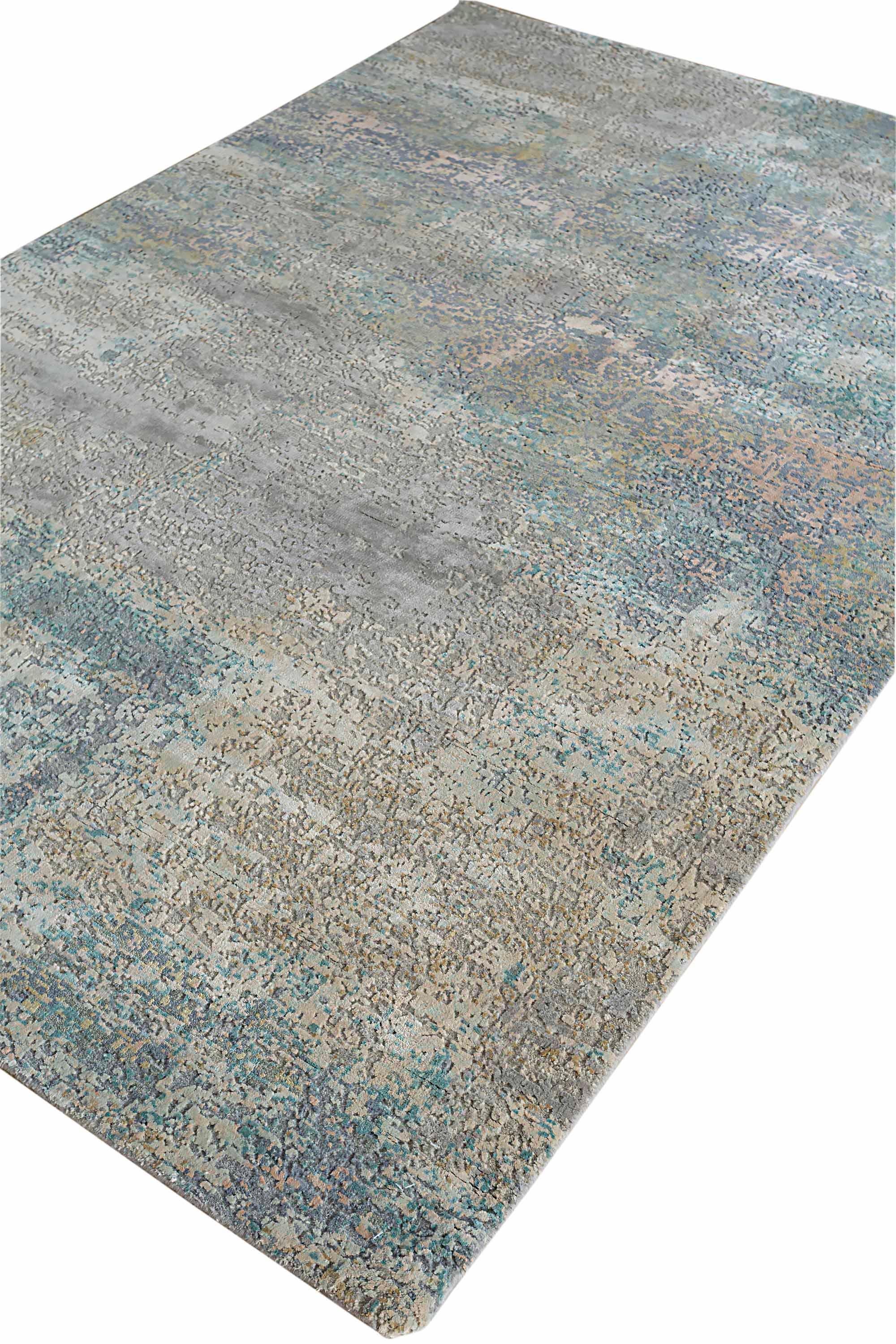 New area rug handwoven from the finest sheep’s wool and real silk. It’s colored with all-natural vegetable dyes that are safe for humans and pets. It features beautiful modern watercolor art design patterns that blend perfectly with contemporary