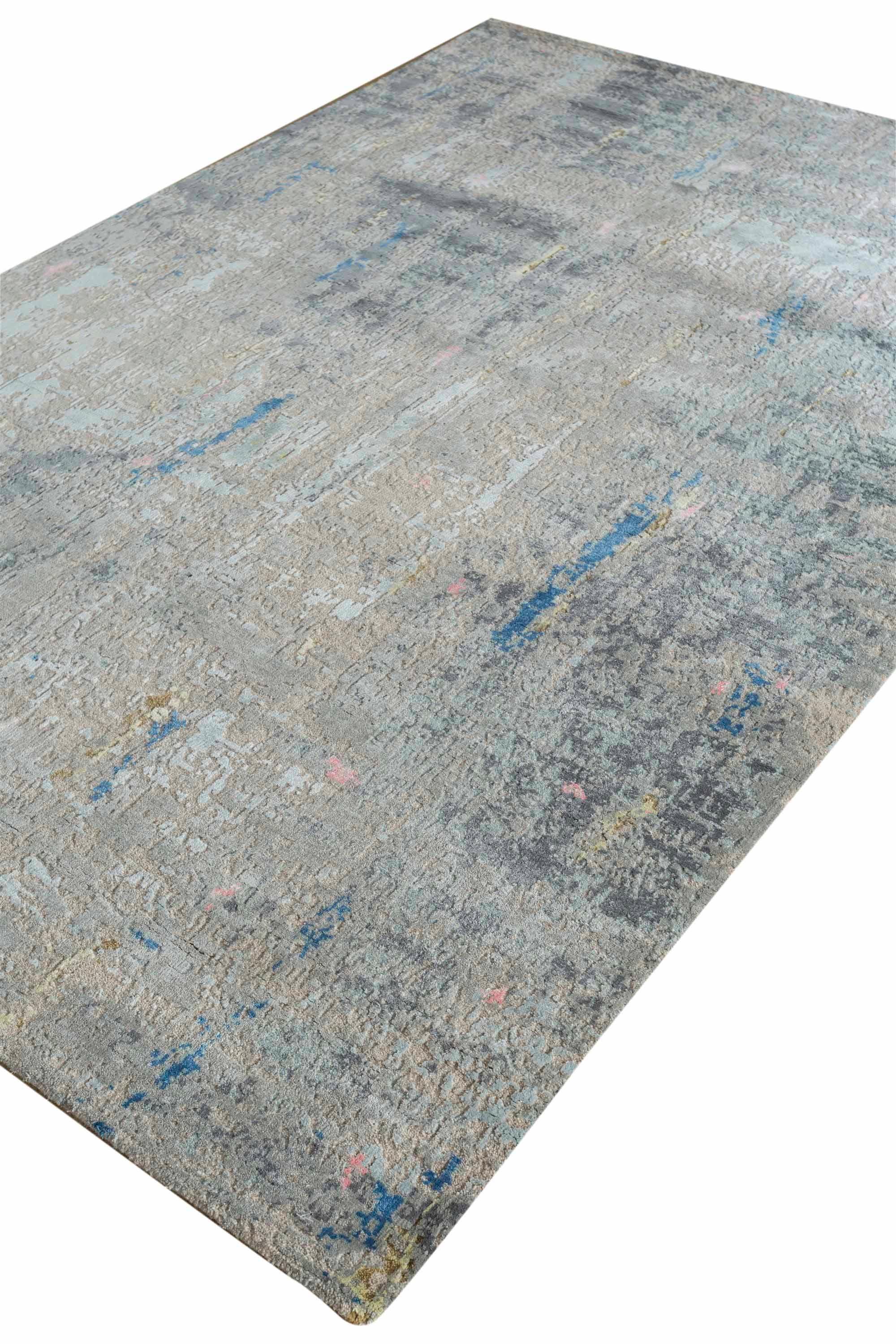 New area rug handwoven from the finest sheep’s wool and real silk. It’s colored with all-natural vegetable dyes that are safe for humans and pets. It features beautiful modern watercolor art design patterns that blend perfectly with contemporary