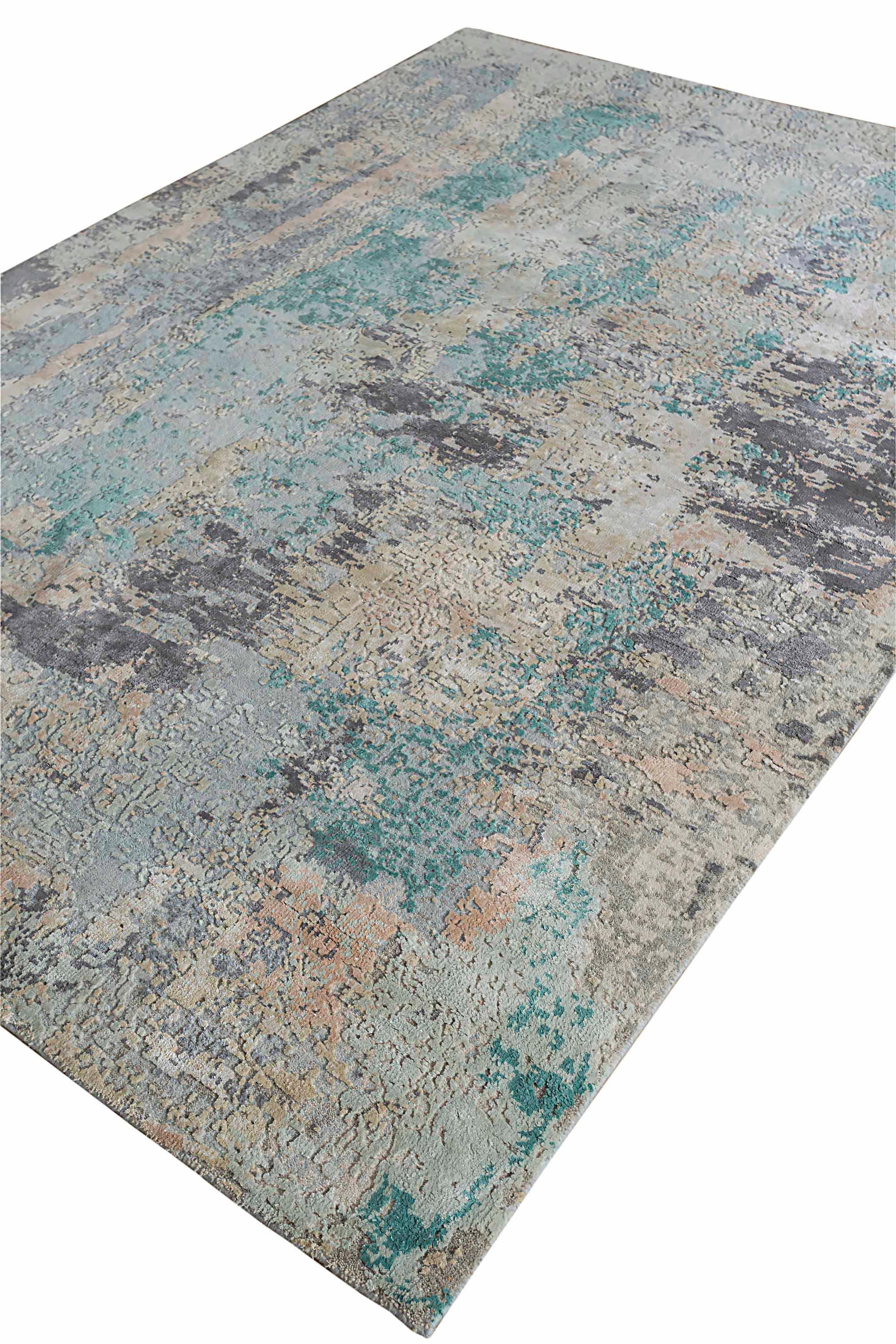 New area rug handwoven from the finest sheep’s wool and real silk. It’s colored with all-natural vegetable dyes that are safe for humans and pets. It features beautiful modern watercolor art design patterns that blend perfectly with contemporary