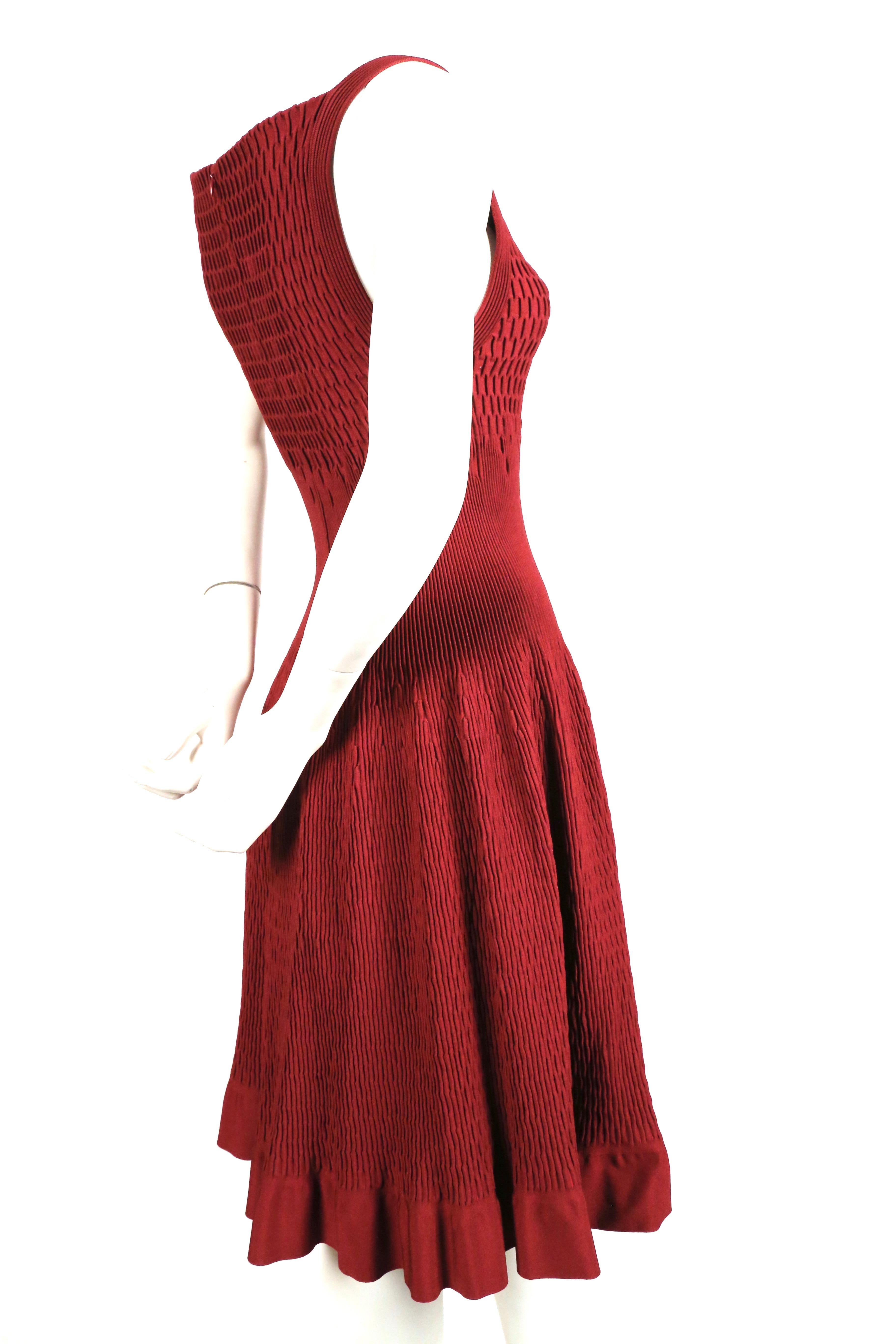 Bordeaux knit dress with intricate plisse woven pleats from Azzedine Alaia. New with tags. French size 40 however runs small and best fits a FR 36 or 38. Approximate measurements (unstretched): bust 24