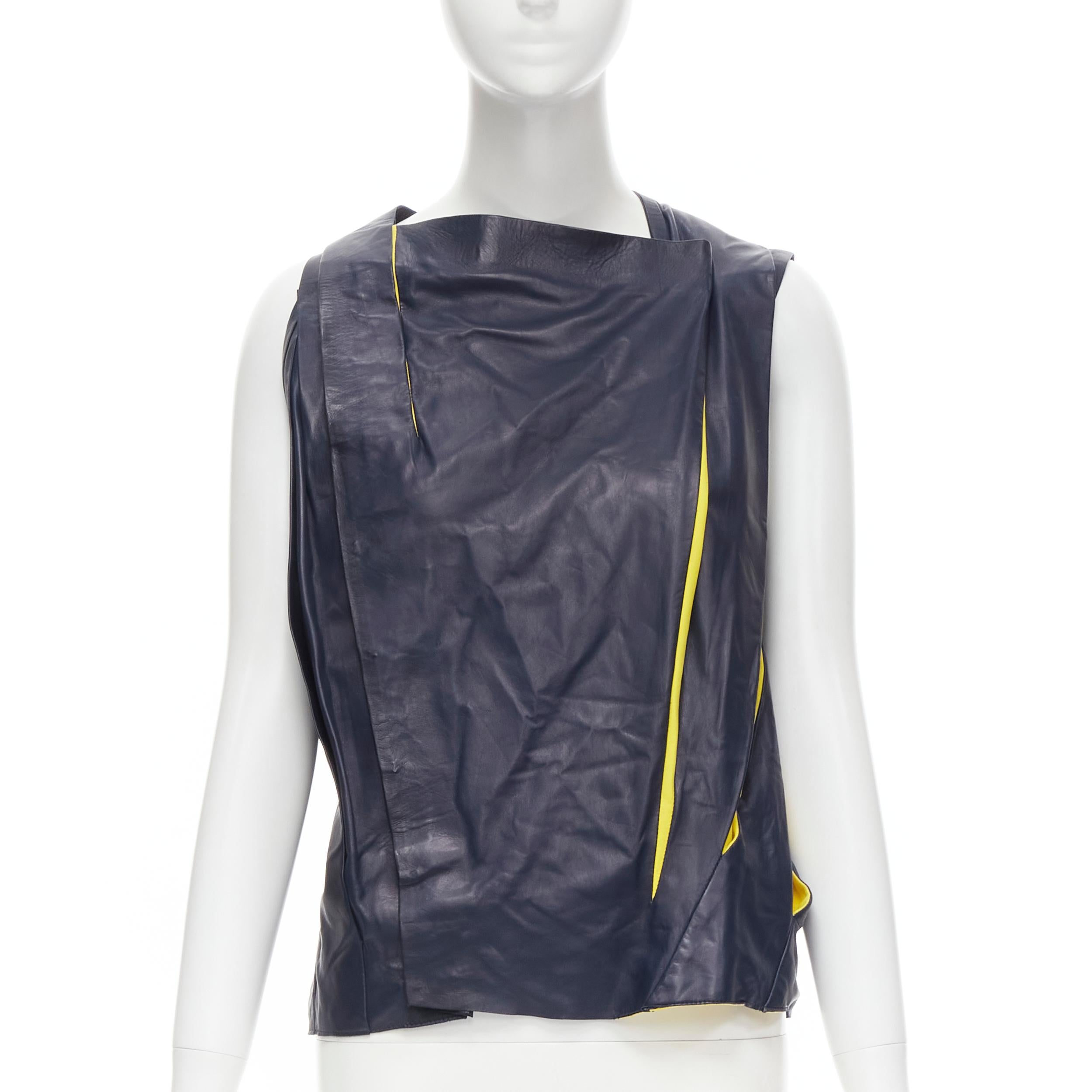 new BALENCIAGA 2010 Runway Nicolas Ghesquiere navy yellow leather pleated top FR38 S 
Reference: MELK/A00143 
Brand: Balenciaga 
Designer: Nicolas Ghesquiere 
Collection: Spring Summer 2010 Look 23 Runway 
Material: Leather 
Color: Navy 
Pattern: