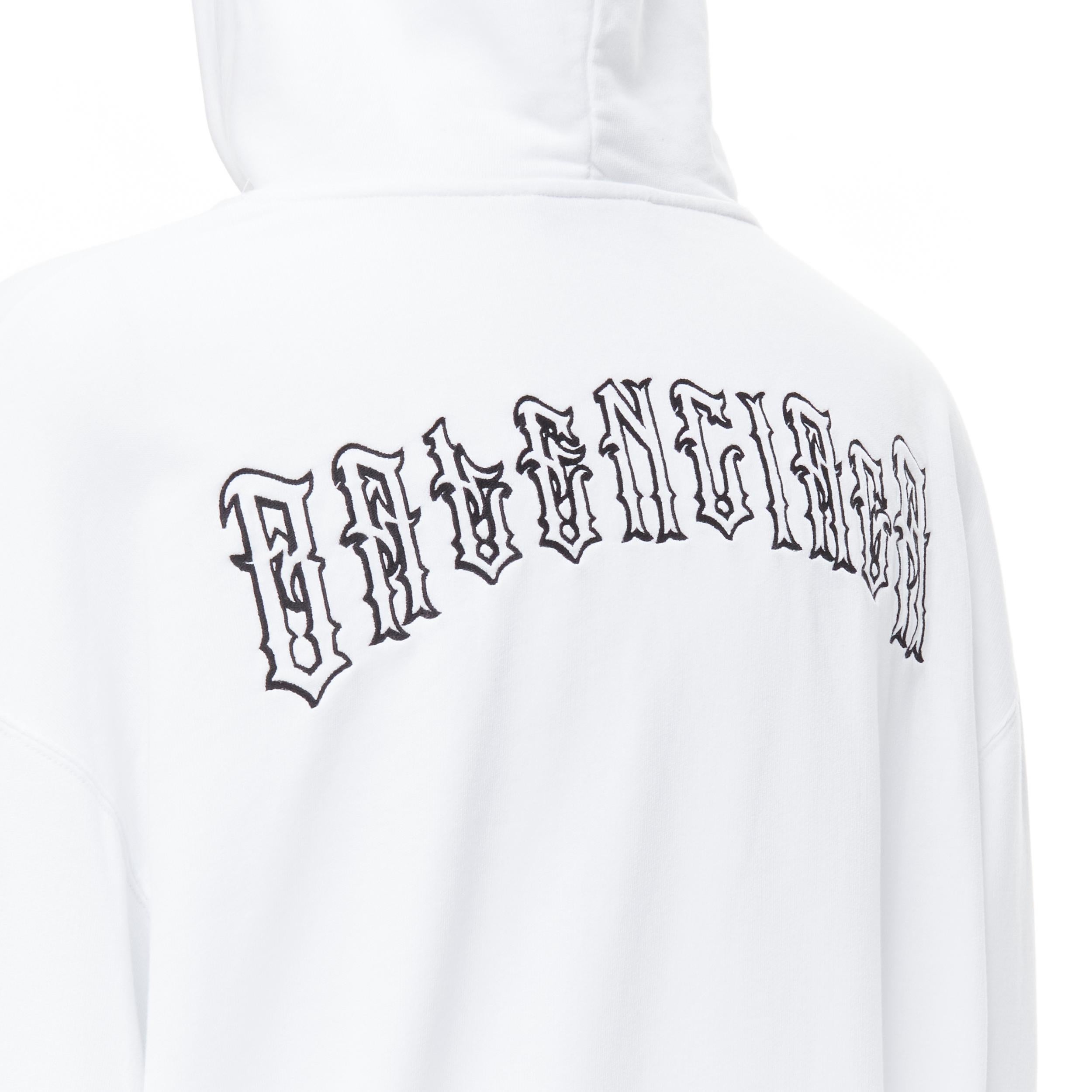 new BALENCIAGA 2018 black Gothic Tattoo logo embroidery white cotton hoodie M 
Reference: TGAS/B01532 
Brand: Balenciaga 
Designer: Demna Gvasalia 
Collection: 2018 
Material: Cotton 
Color: White 
Pattern: Solid 
Closure: Drawstring 
Extra Detail: