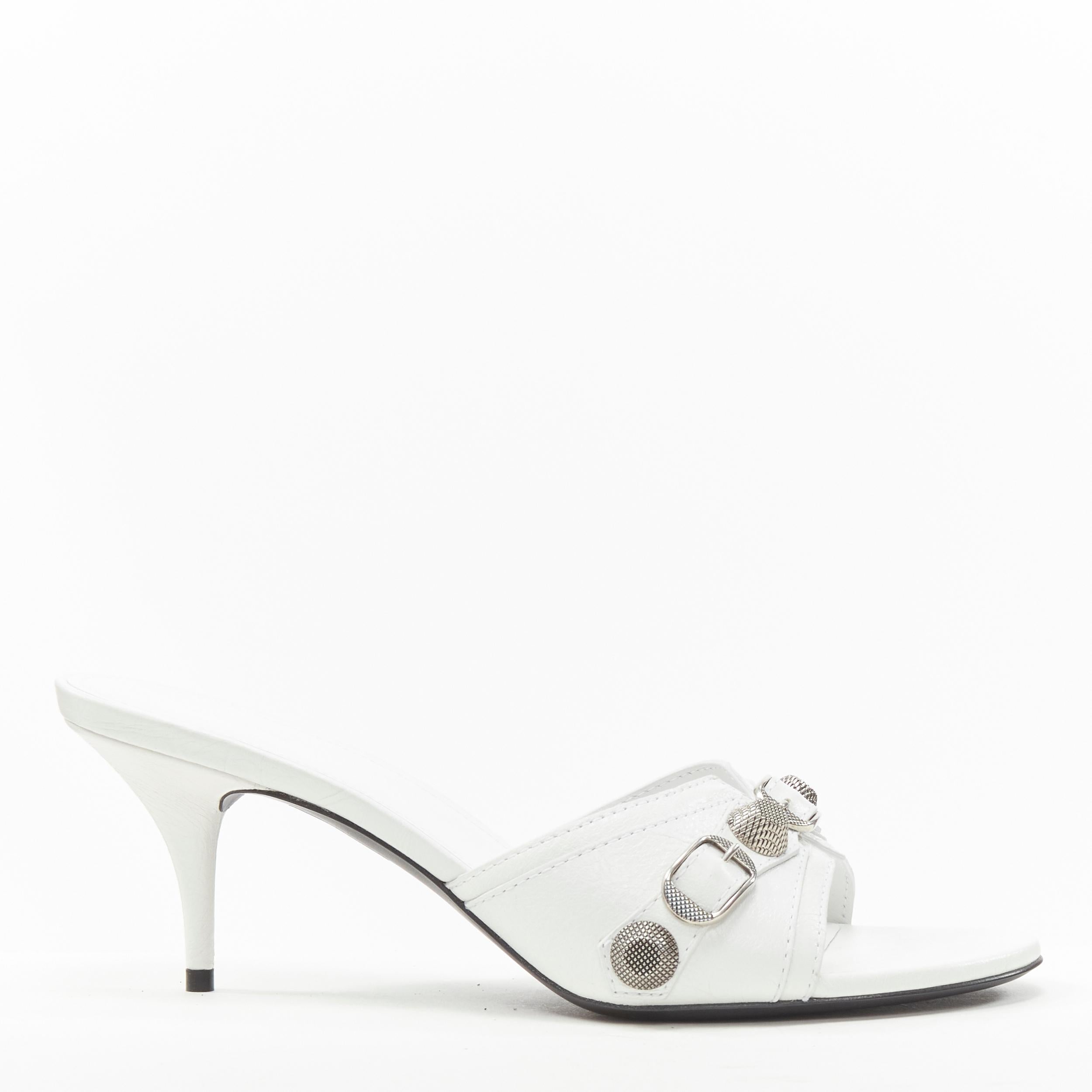 new BALENCIAGA 2022 Cagole white leather silver studded mule heel EU39 US9 
Reference: TGAS/B02226 
Brand: Balenciaga 
Designer: Demna 
Model: Cagole 
Collection: 2022 
Material: Leather 
Color: White 
Pattern: Solid 
Extra Detail: Balenciaga's