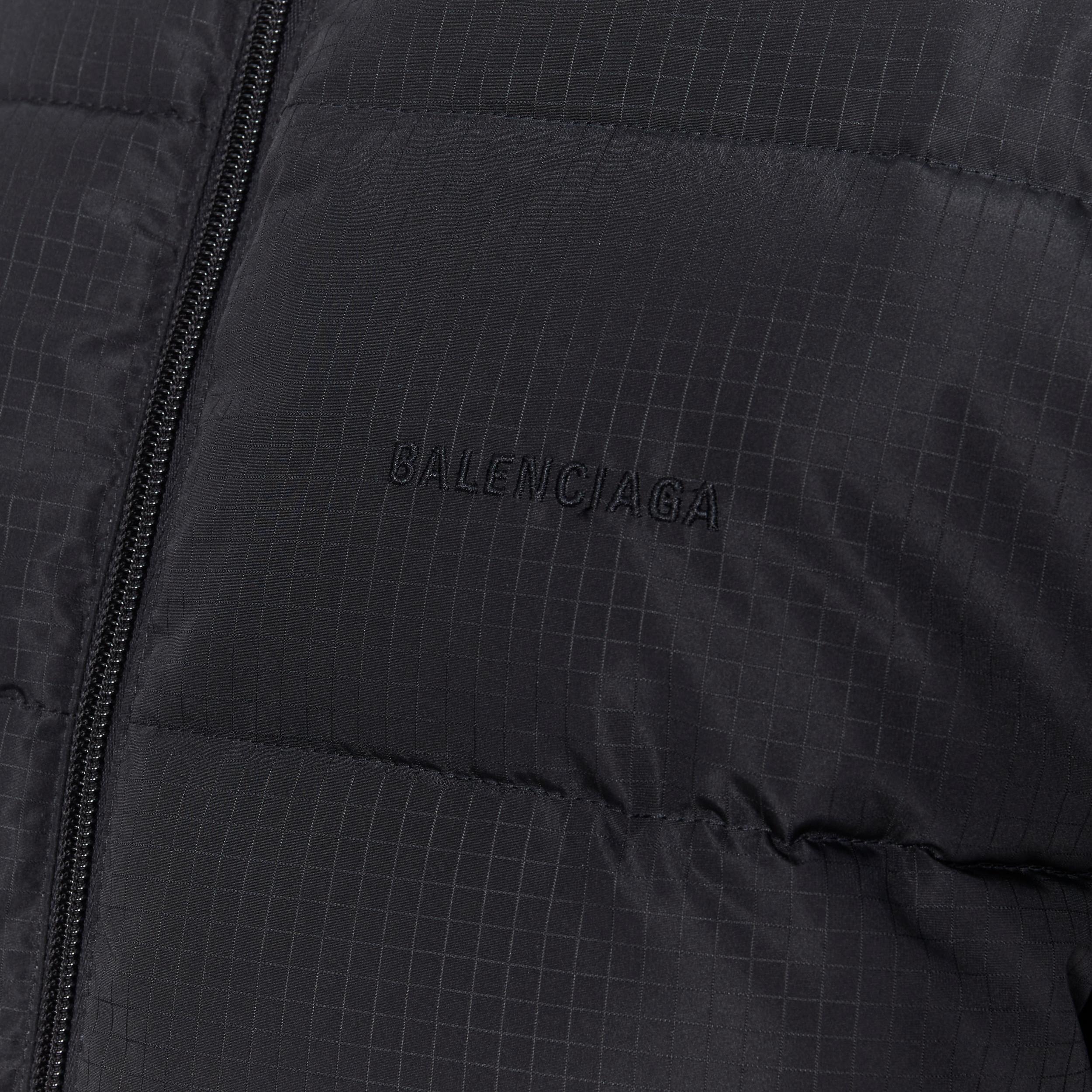 new BALENCIAGA DEMNA black grid nylon logo zip down feather puffer jacket FR36 
Reference: TGAS/B00179 
Brand: Balenciaga 
Designer: Demna Gvasalia 
Material: Nylon 
Color: Black 
Pattern: Solid 
Closure: Zip 
Made in: Italy 

CONDITION: 
Condition: