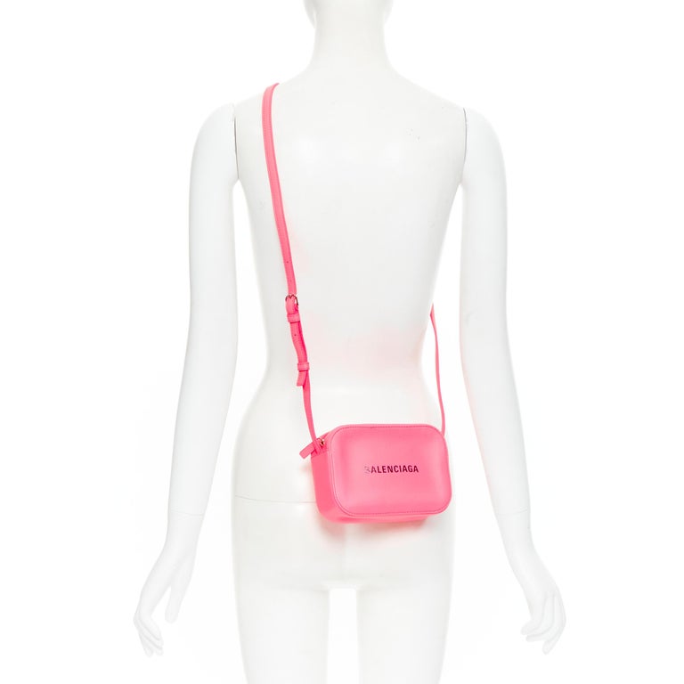 new BALENCIAGA Everyday Camera neon pink leather black logo print crossbody bag at | neon pink crossbody bag, balenciaga pink handbag, balenciaga pink bag
