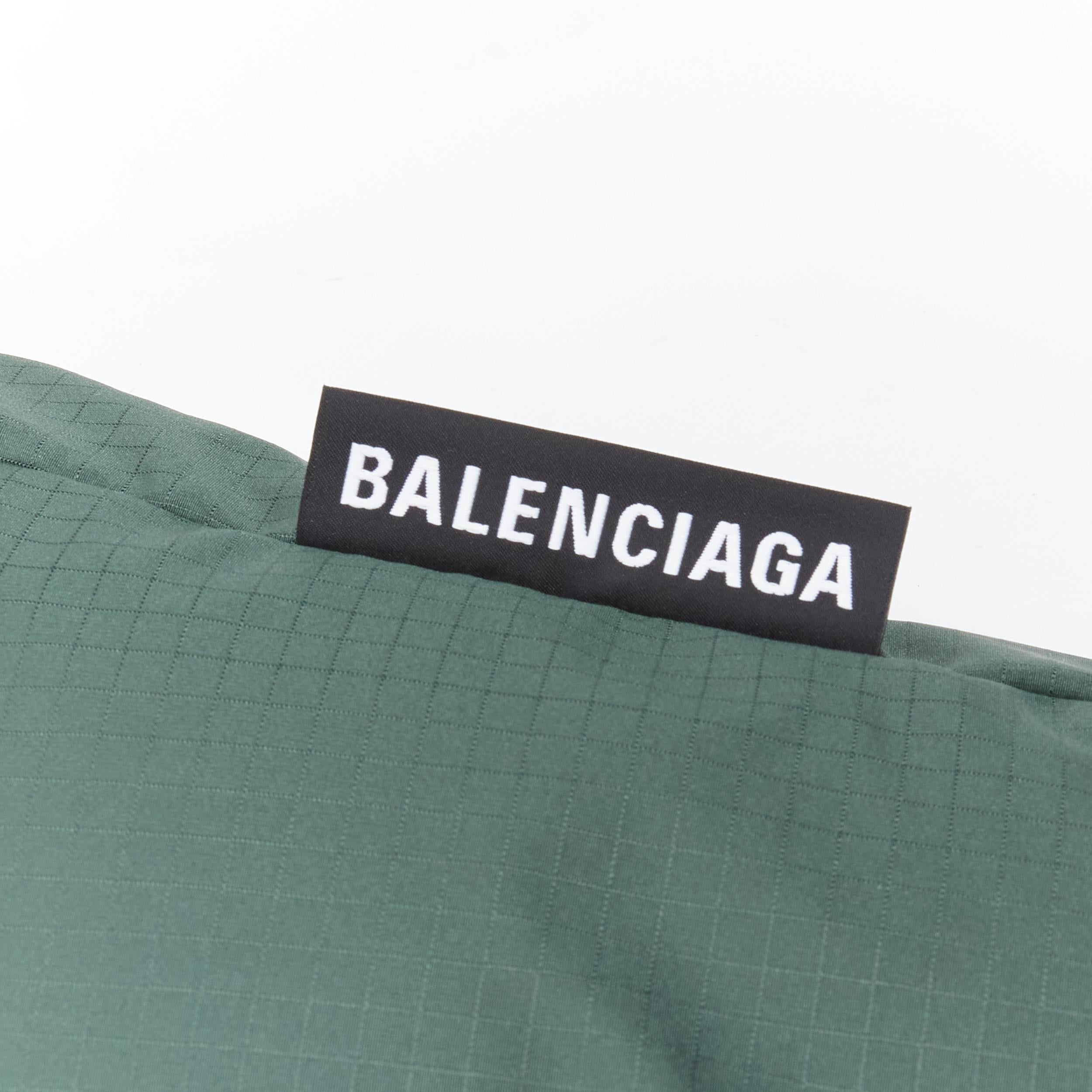 new BALENCIAGA green grid nylon logo embroidered oversized padded puffer EU46 S 
Reference: TGAS/B01580 
Brand: Balenciaga 
Designer: Demna Gvasalia 
Material: Nylon 
Color: Green 
Pattern: Solid 
Closure: Zip 
Extra Detail: Logo embroidery at