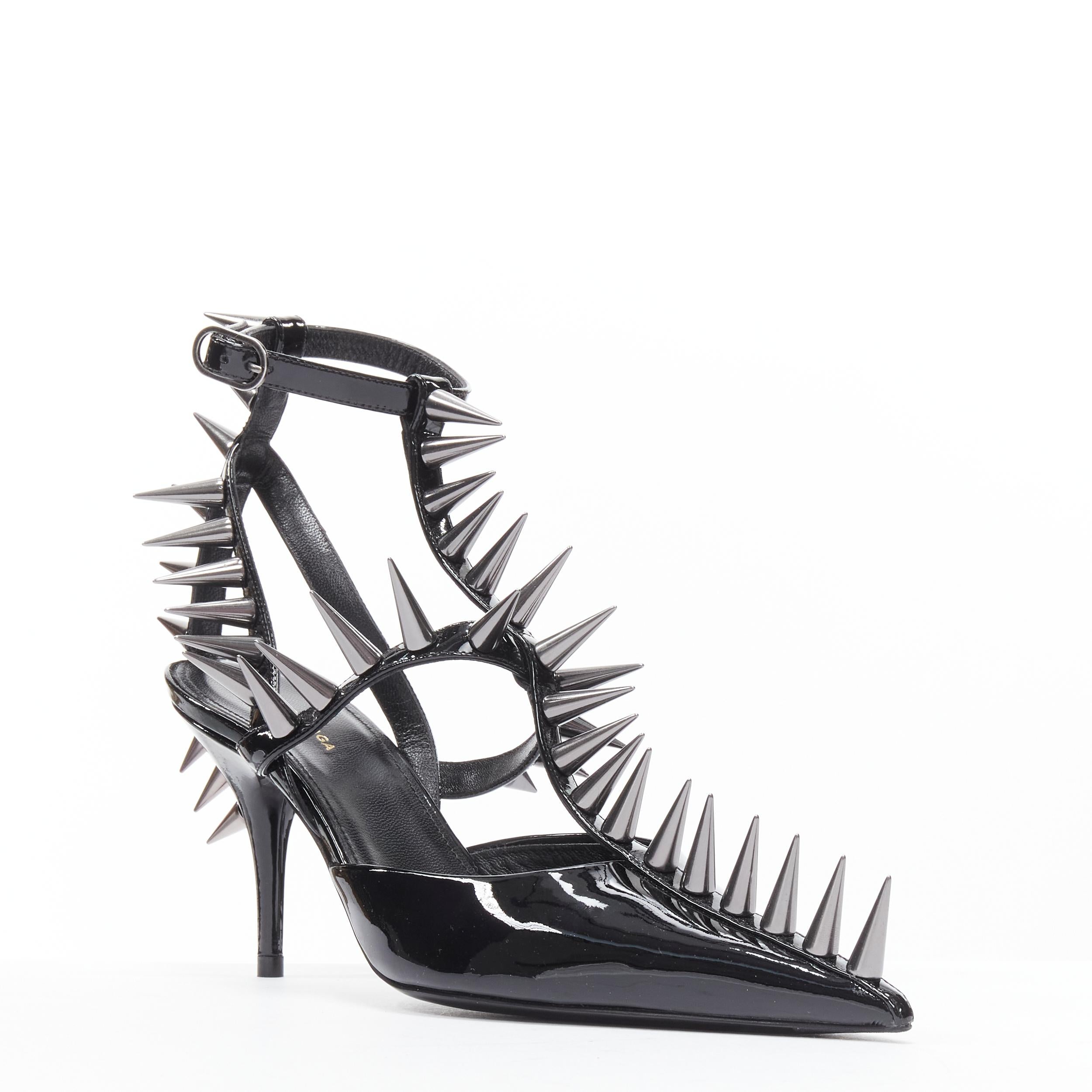 new BALENCIAGA Runway Black Knife Spike 90 punk stud black caged heel EU36 
Reference: TGAS/B01584
Brand: Balenciaga 
Designer: Demna Gvasalia 
Model: Spike heel 
Material: Patent Leather 
Color: Black 
Pattern: Solid 
Closure: Buckle 
Extra Detail: