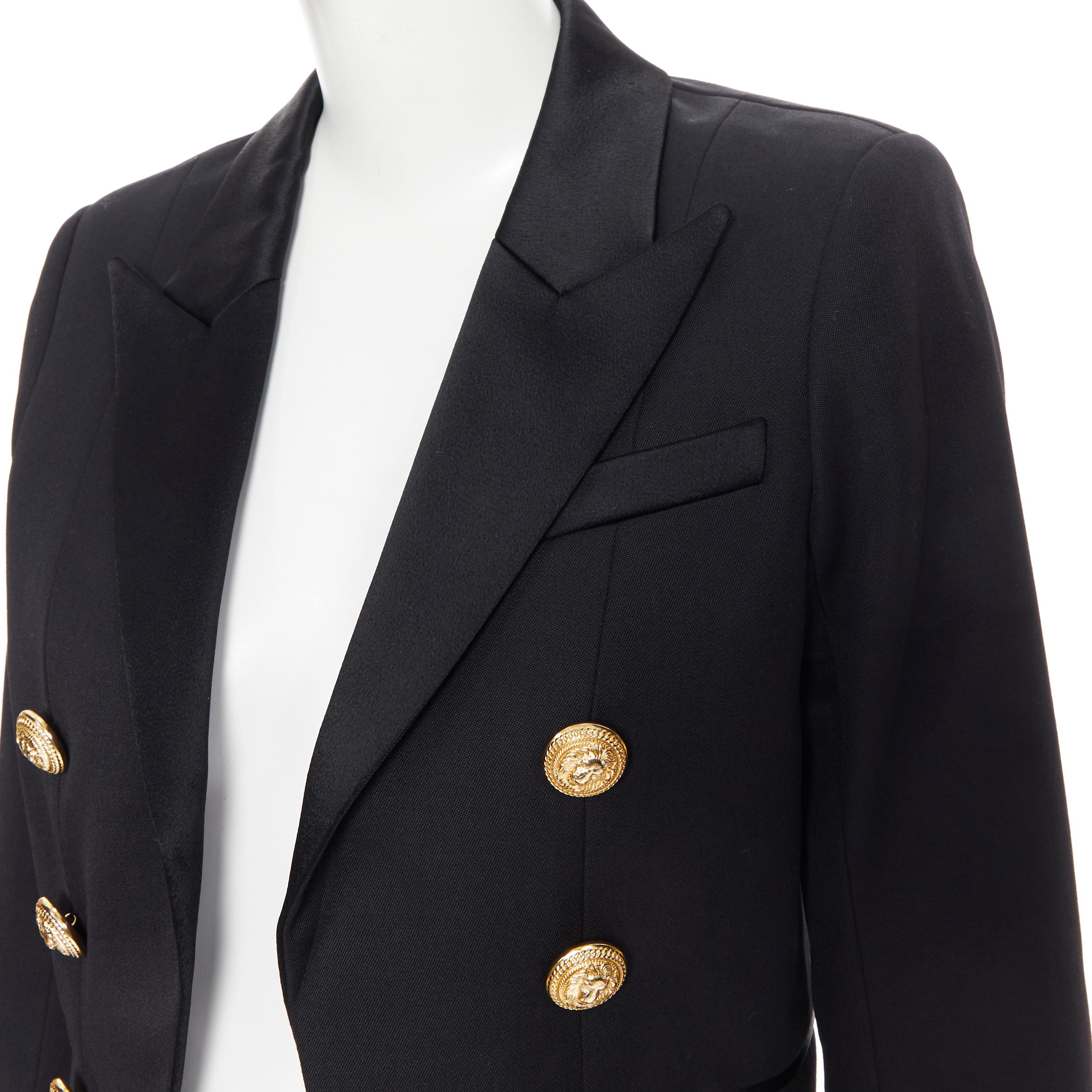 new BALMAIN black worsted wool peak lapel gold double breasted crop blazer FR38
Brand: Balmain
Designer: Olivier Rousteing
Model Name / Style: Double breasted blazer
Material: Wool
Color: Black
Pattern: Solid
Closure: Button
Extra Detail: Padded