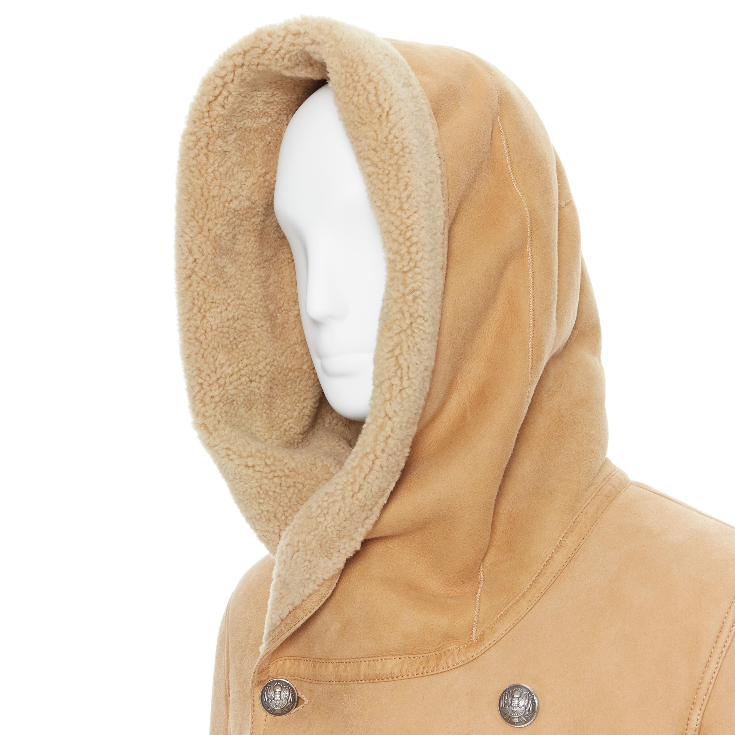 new BALMAIN tan brown  silver double breasted hooded shearling leather coat EU48
Brand: Balmain
Designer: Olivier Rousteing
Model Name / Style: Shearling coat
Material: Other; 100% Shearling
Color: Brown
Pattern: Solid
Closure: Button
Extra Detail: